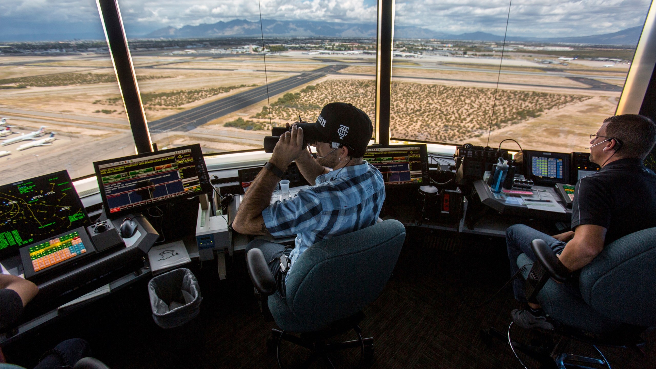 FILE - Air traffic controllers watch for traffic from the control tower at the Tucson International Airport, Friday, Sept. 23, 2016, in Tucson, Ariz. The Federal Aviation Administration said Wednesday, July 24, 2024, that it reached an agreement the union that allow air traffic controllers to get more rest between shifts. (Ron Medvescek/Arizona Daily Star via AP, File)