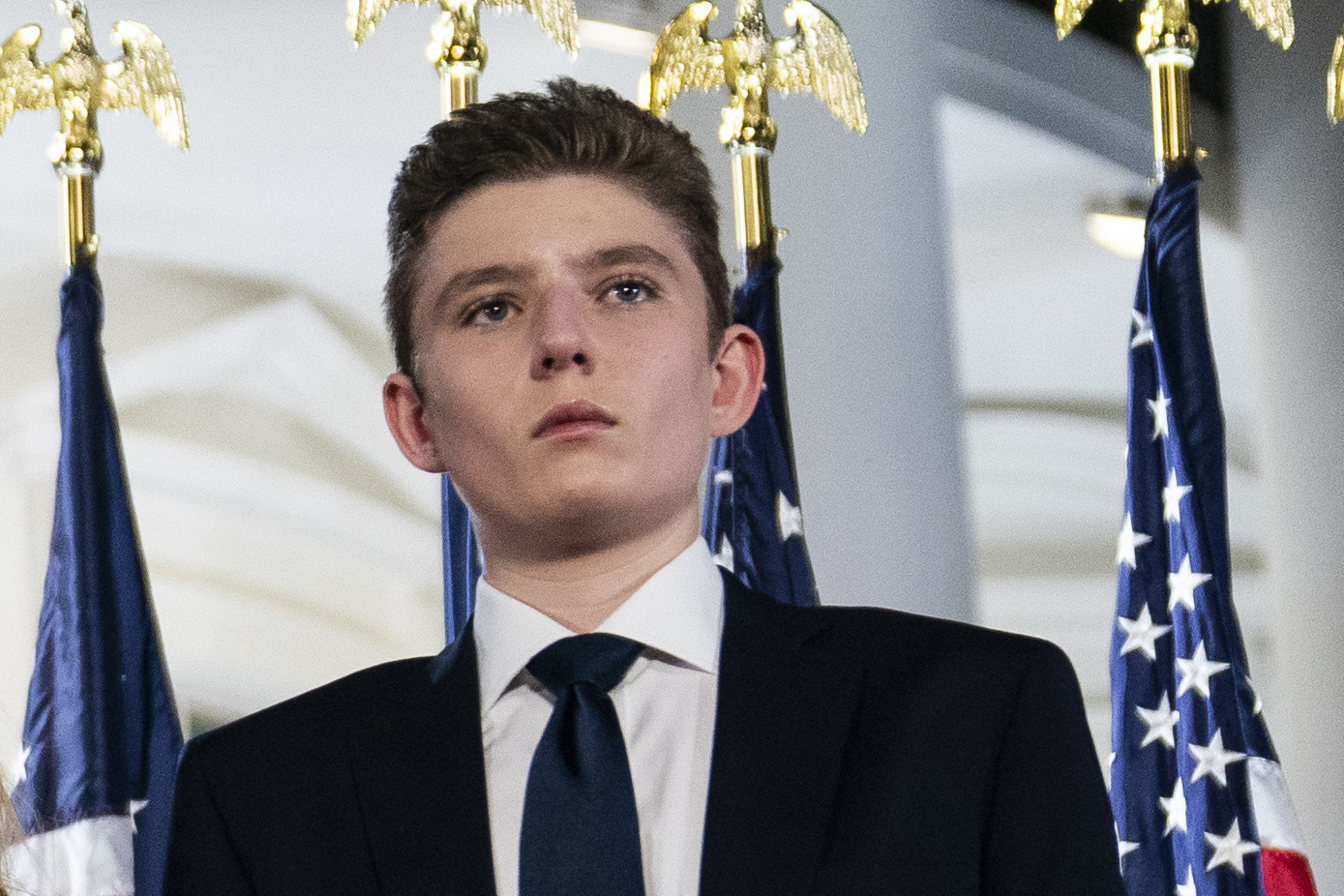 FILE - Barron Trump stands on the South Lawn of the White House on the fourth day of the Republican National Convention in Washington, Aug. 27, 2020. (AP Photo/Evan Vucci, File)