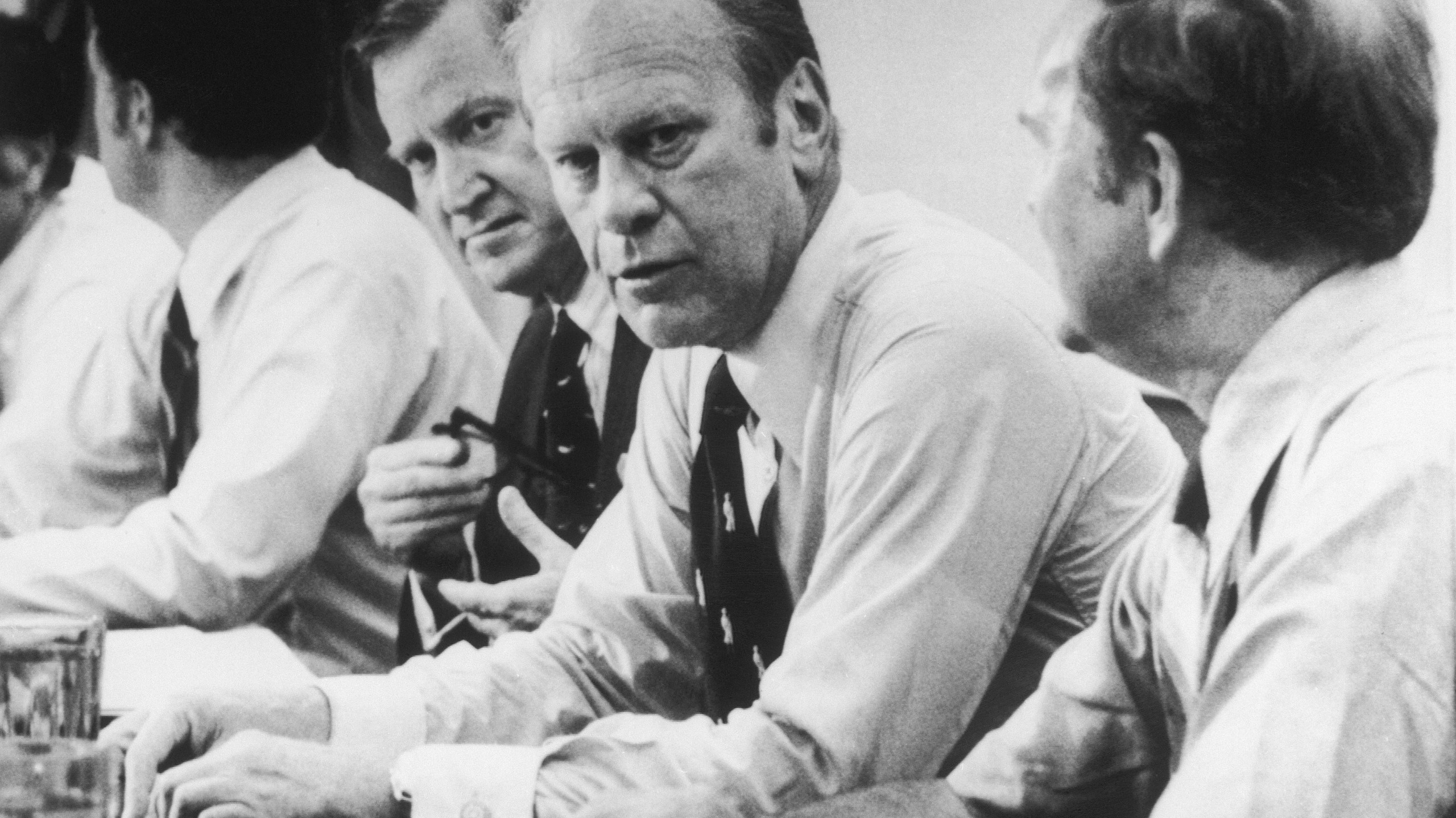 FILE - President Gerald Ford looks over the conference table during a shirtsleeve, closed door meeting with Environmental Protection Agency officials in Cincinnati, July 3, 1975. (AP Photo/Barry Thumma, File)