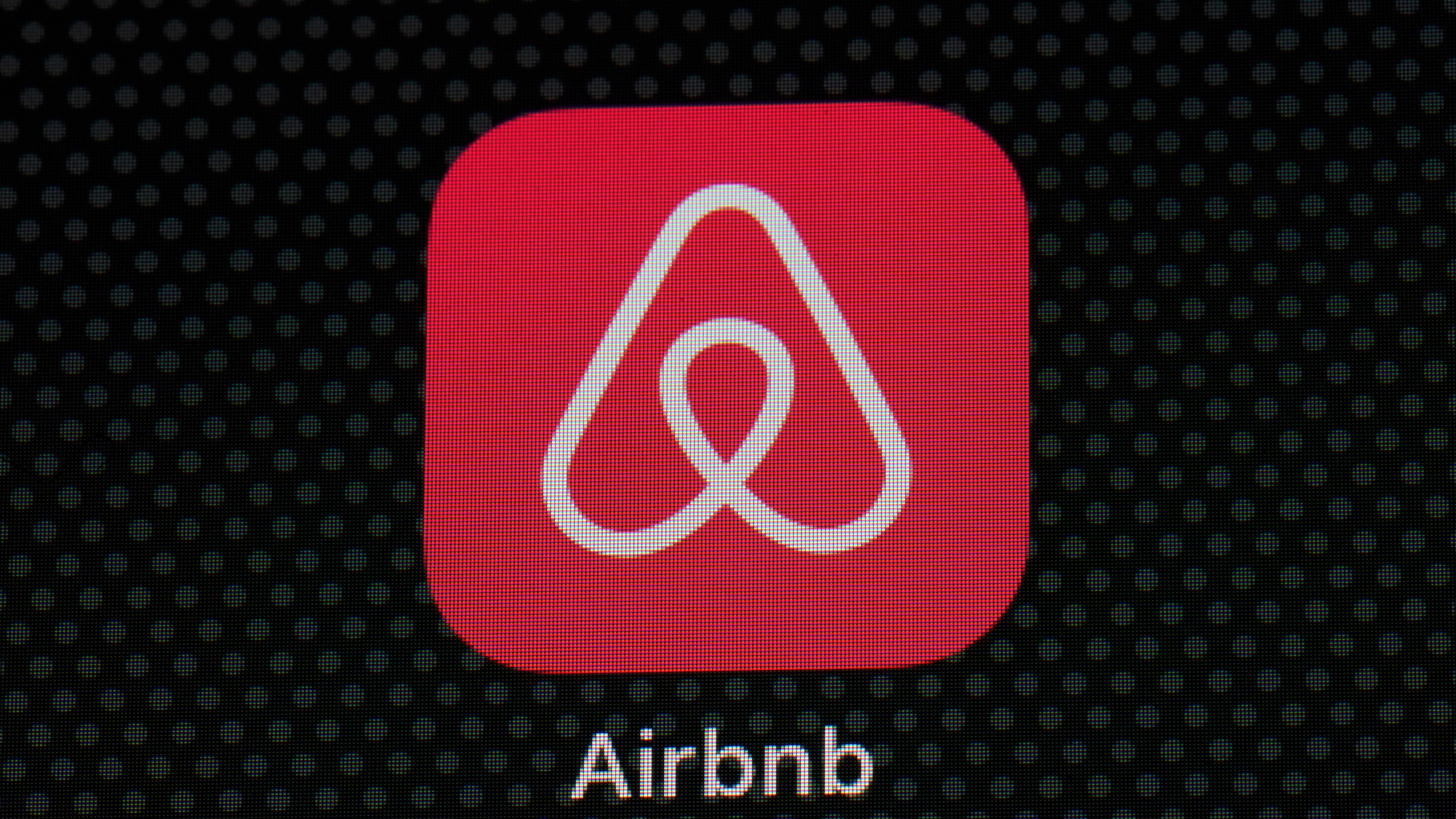 FILE - The Airbnb app icon is displayed on an iPad screen in Washington, D.C., May 8, 2021. (AP Photo/Patrick Semansky, File)