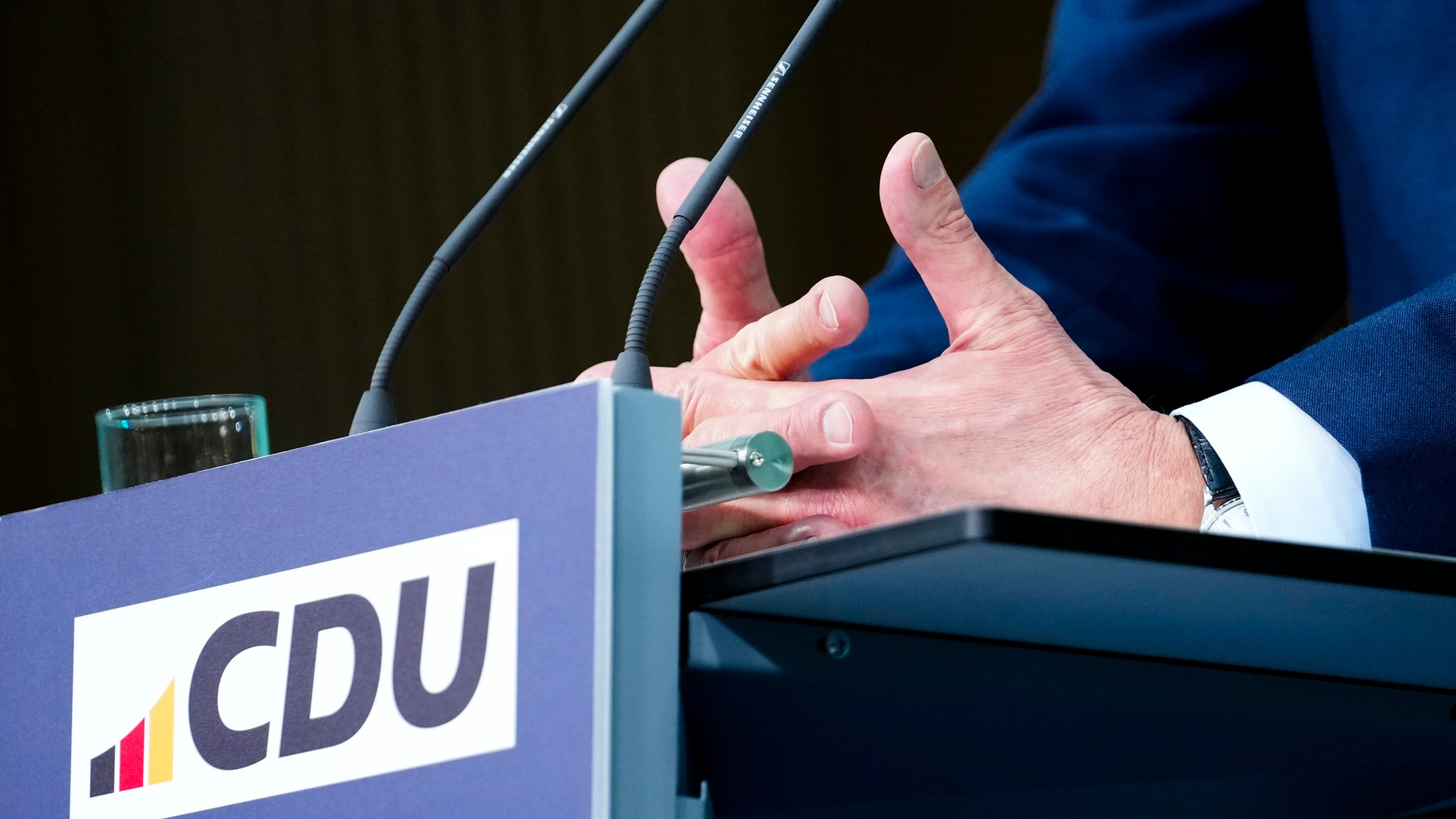 The hands of Friedrich Merz, leader of the Christian Democratic Union (CDU), as he speaks during a news conference at the headquarters of Christian Democratic Union (CDU) party in Berlin, Germany, Monday, Feb. 24, 2025. (AP Photo/Martin Meissner)