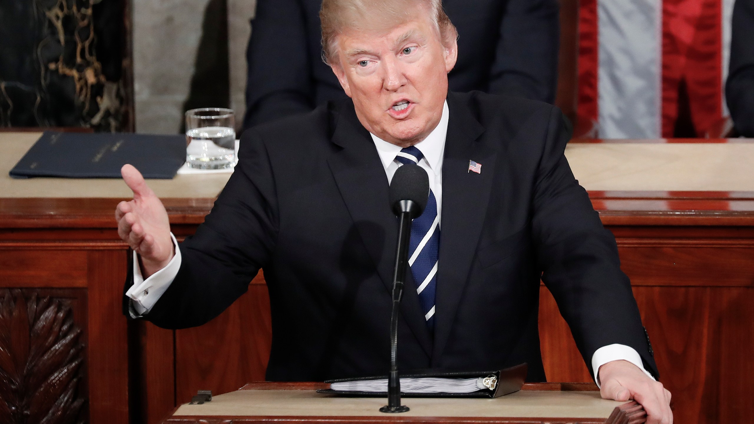 FILE - President Donald Trump gestures towards Democrats while addressing a joint session of Congress at the U.S. Capitol in Washington, Feb. 28, 2017. (AP Photo/Pablo Martinez Monsivais, File)