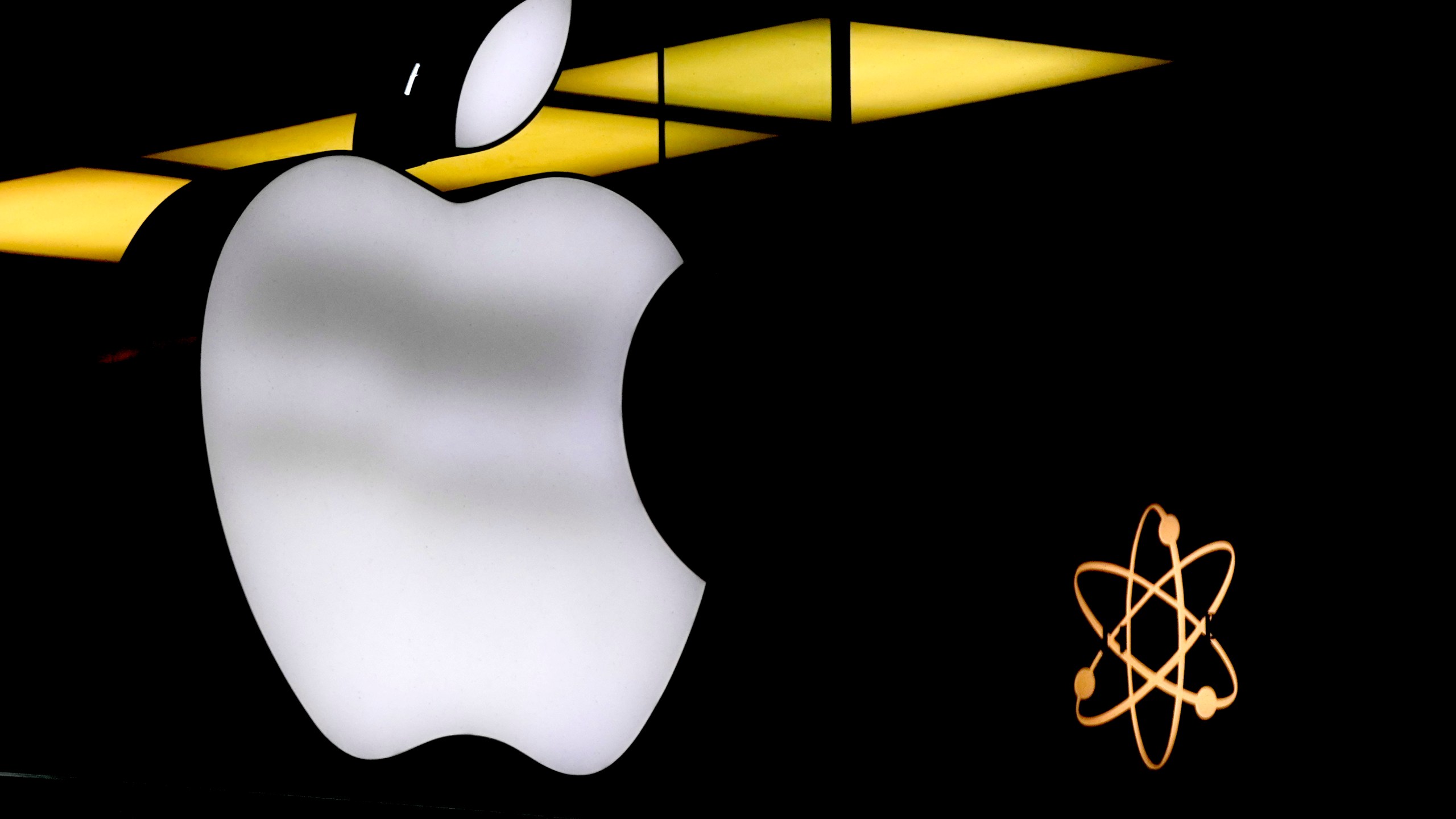 FILE - The Apple logo is illuminated at a store in Munich, Germany, Monday, Nov. 13, 2023. AP Photo/Matthias Schrader, File)(