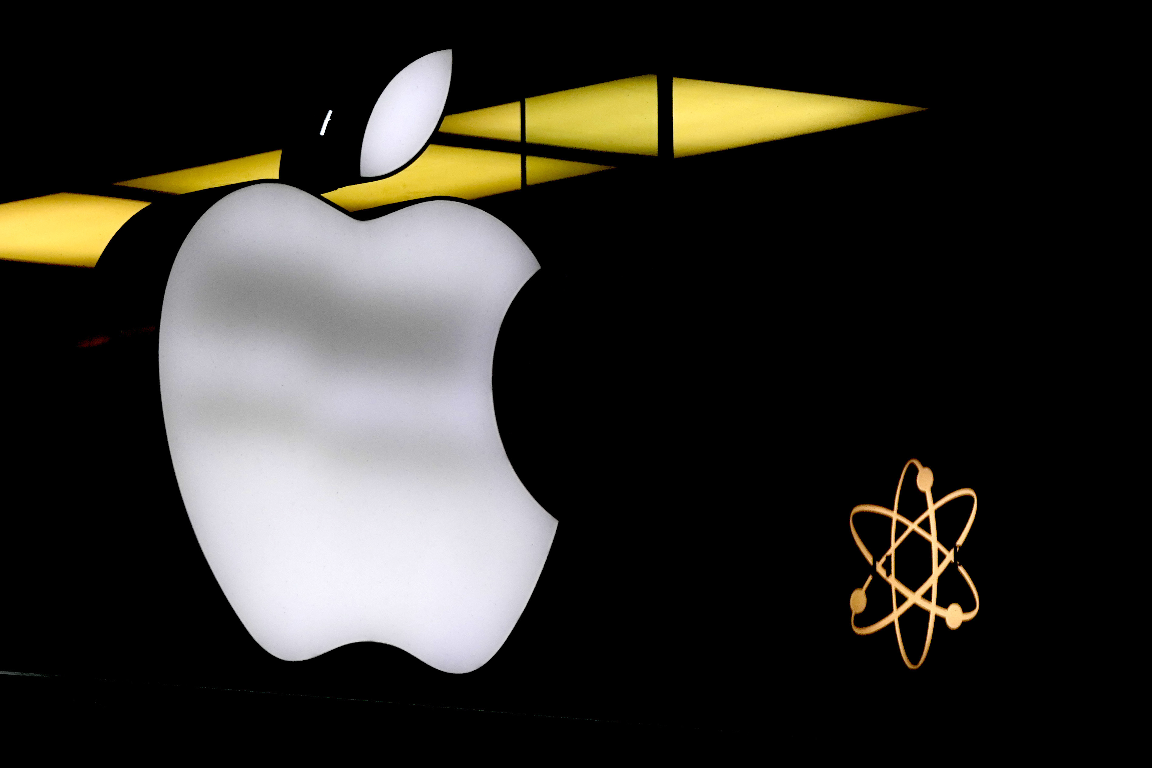 FILE - The Apple logo is illuminated at a store in Munich, Germany, Monday, Nov. 13, 2023. AP Photo/Matthias Schrader, File)(
