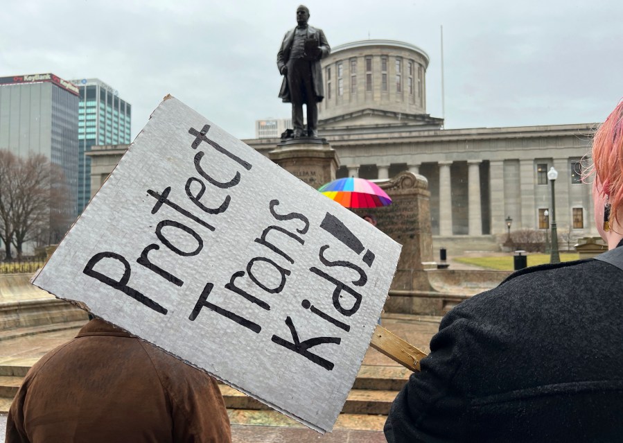 FILE - Protesters advocating for transgender rights and healthcare stand outside of the Ohio Statehouse on Wednesday, Jan. 24, 2024, in Columbus, Ohio. (AP Photo/Patrick Orsagos, File)