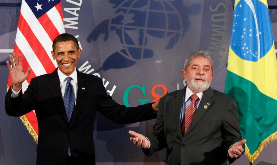 FILE - U.S. President Barack Obama, left, and Brazil's President Luiz Inacio Lula da Silva, react during the G8 Summit in L'Aquila, Italy, July 9, 2009. (AP Photo/Haraz N. Ghanbari, File)