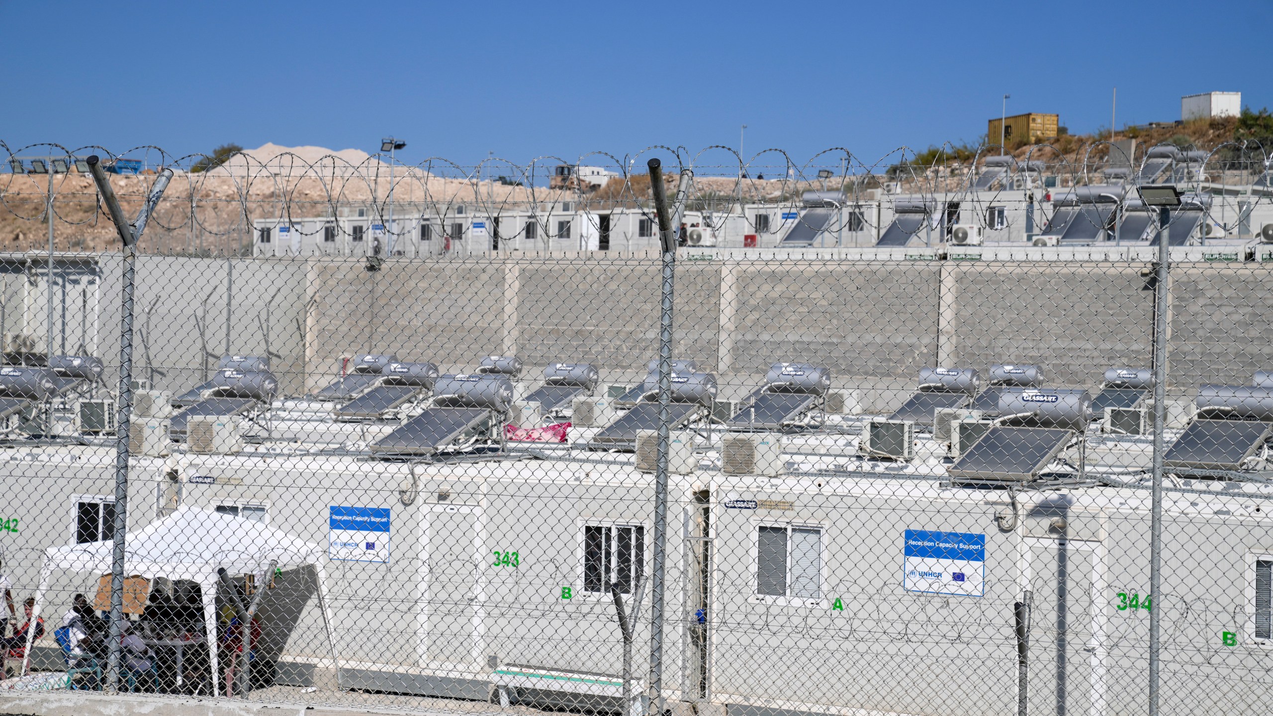 FILE - A facility for migrants and refugees stands in Zervou village on the eastern Aegean island of Samos, Greece, Oct. 1, 2021. (AP Photo/Thanassis Stavrakis, File)