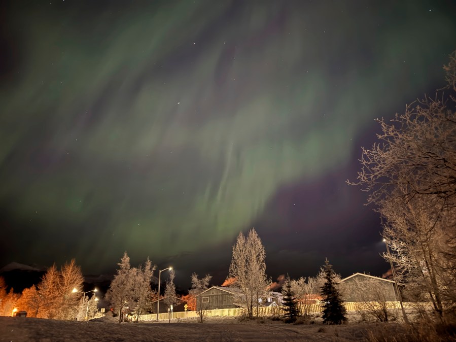 FILE - The northern lights appear over Anchorage, Alaska, on Jan. 1, 2025. (AP Photo/Mark Thiessen, File)