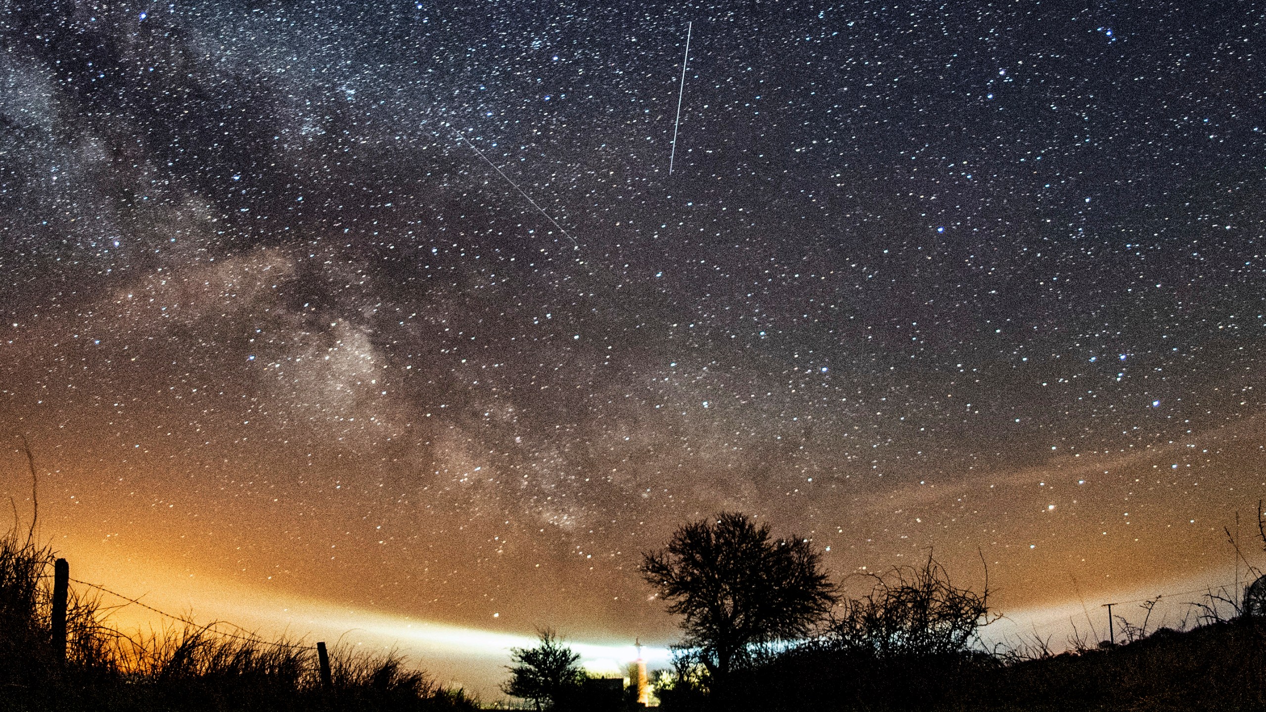 FILE - The Lyrid meteor shower is seen over Burg on the Baltic Sea island of Fehmarn off Germany, Friday, April 20, 2018. (Daniel Reinhardt/dpa via AP, File)