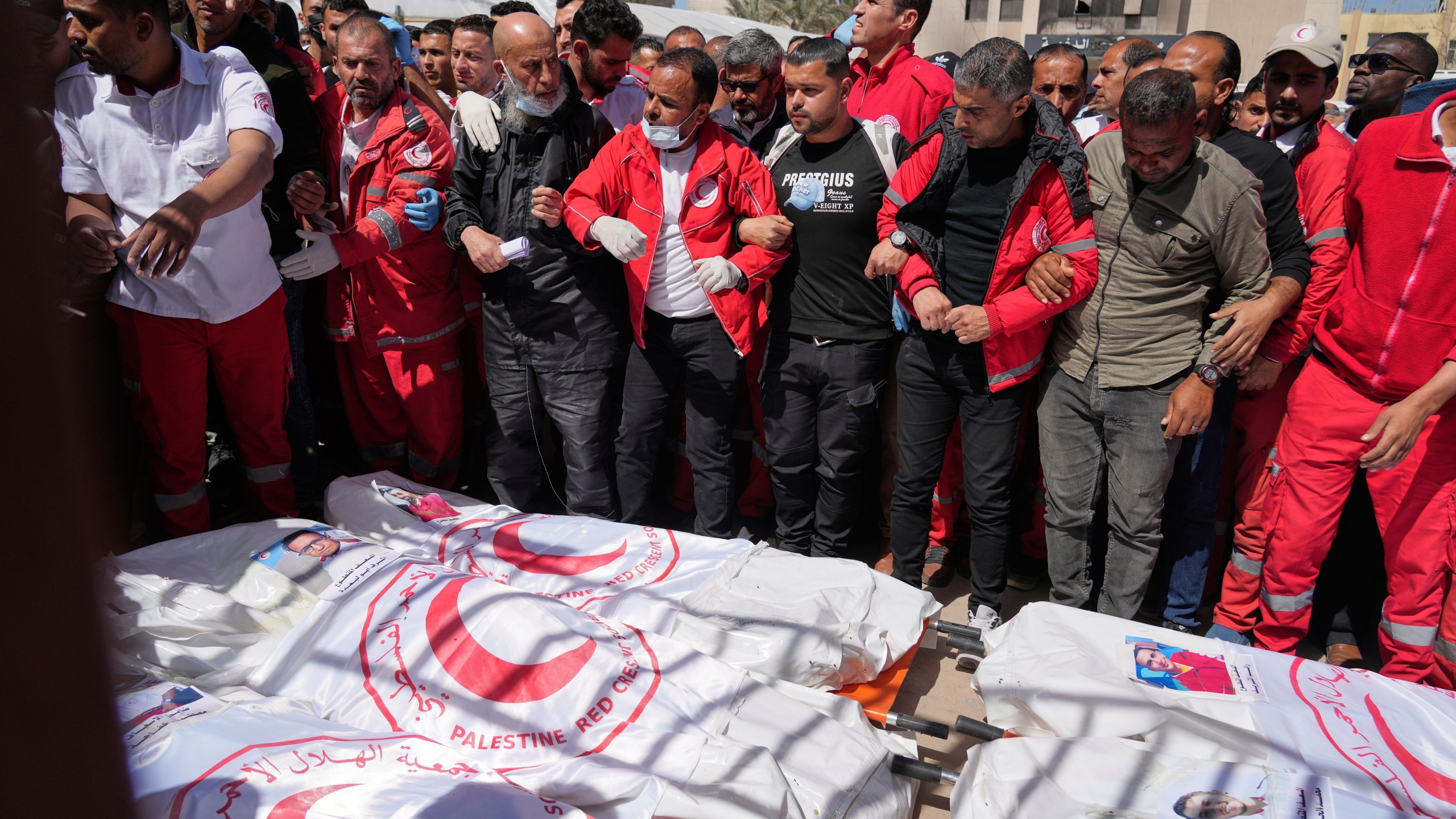 FILE.- Mourners gather around the bodies of 8 Red Crescent emergency responders, recovered in Rafah a week after an Israeli attack, as they are transported for burial from a hospital in Deir al-Balah, Gaza Strip, on Monday, March 31, 2025. (AP Photo/Abdel Kareem Hana, file)
