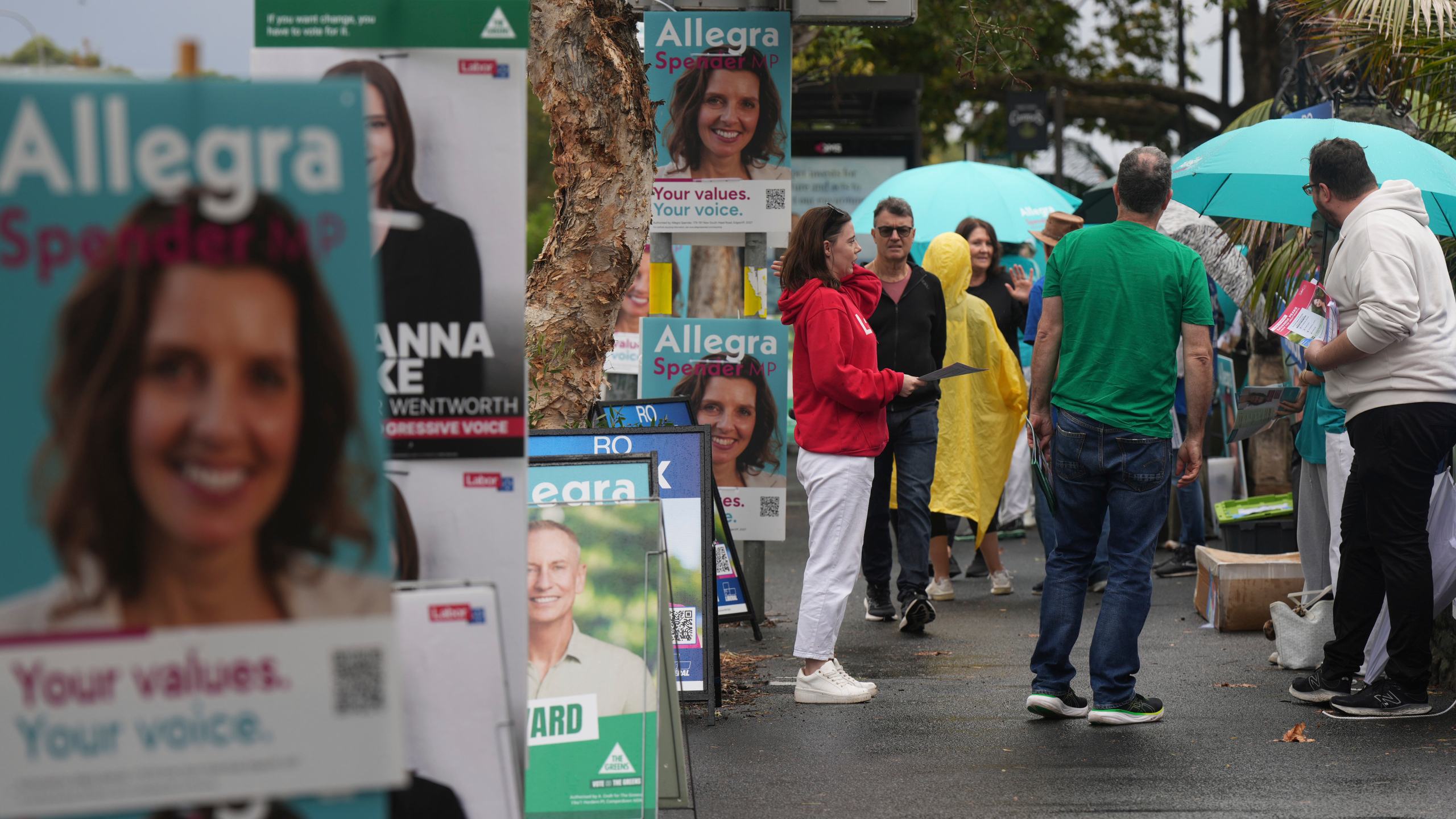 People arrive at a polling place as early voting begins in Sydney, Tuesday, April 22, 2025, for a national election to be held on May 3. (AP Photo/Mark Baker)