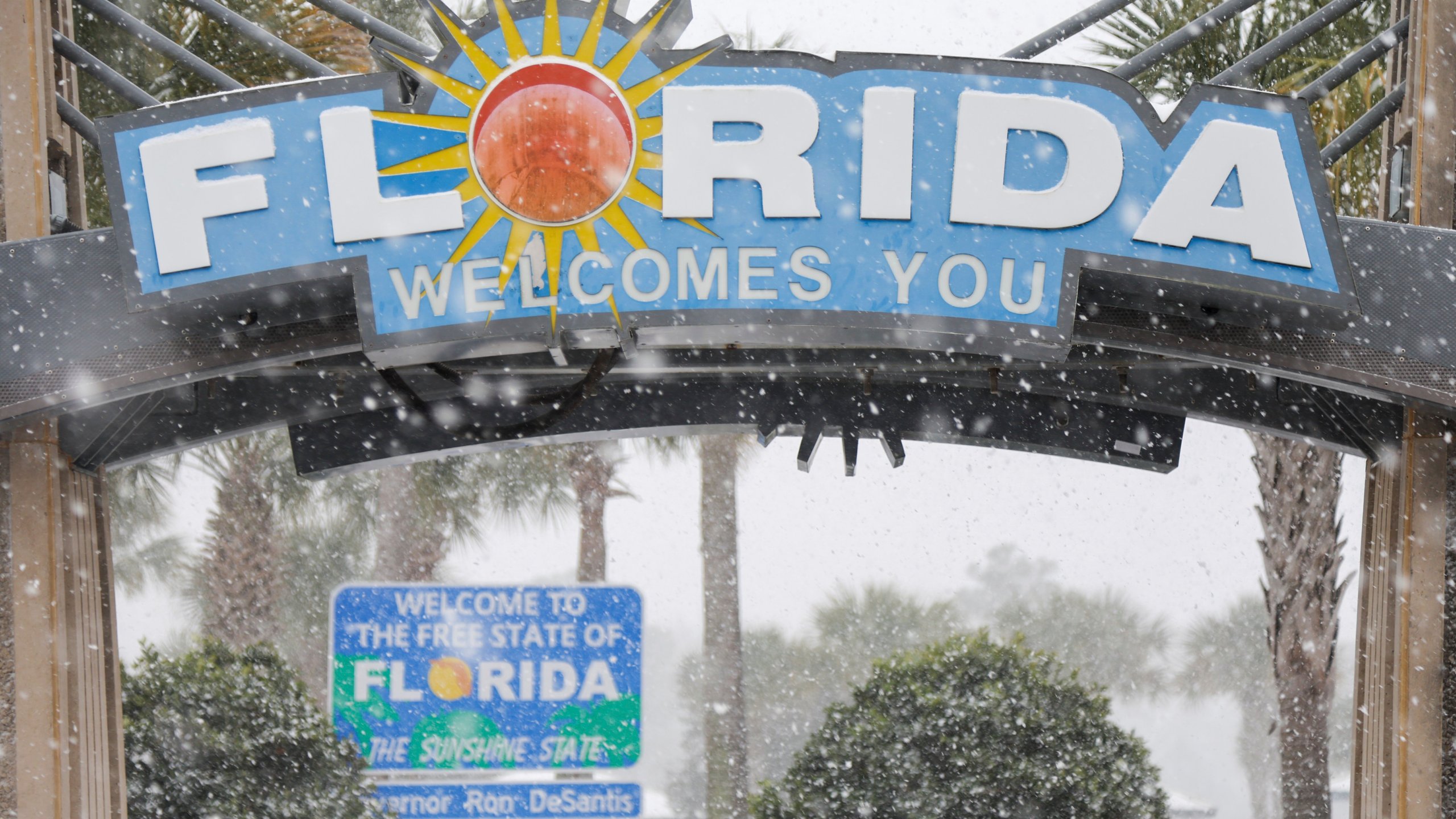 FILE - Heavy snow falls onto the Florida Welcome Center on Jan. 21, 2025 in Pensacola, Fla. (Luis Santana /Tampa Bay Times via AP, File)