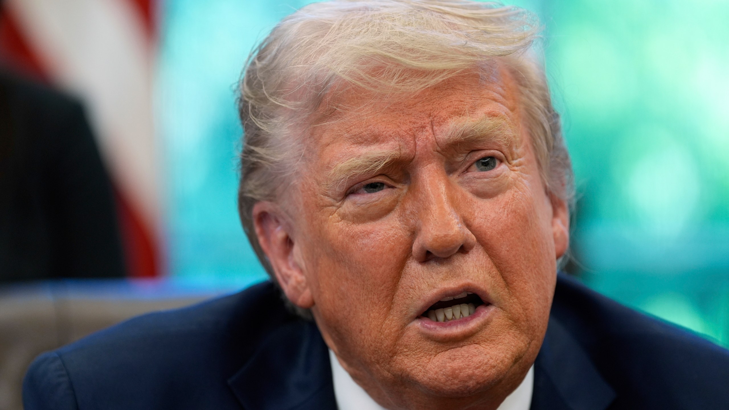 President Donald Trump speaks with reporters after signing executive orders in the Oval Office of the White House, Wednesday, April 23, 2025, in Washington. (AP Photo/Alex Brandon)