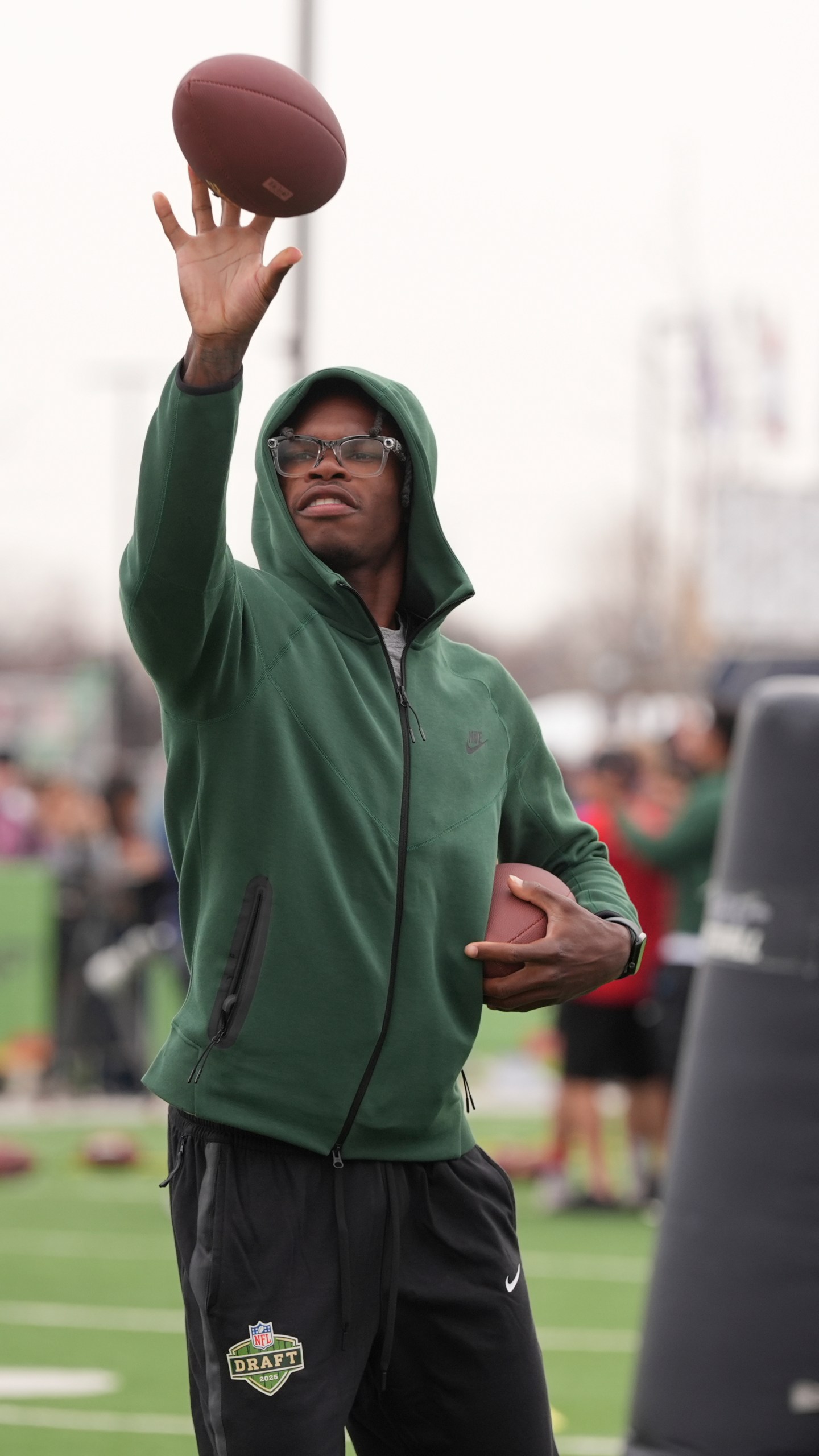 Draft prospect Travis Hunter of Colorado works with local youth football players and Special Olympics athletes during the league's annual prospect clinic ahead of the NFL football draft Wednesday, April 23, 2025, in Green Bay, Wis. (AP Photo/Jeff Roberson)