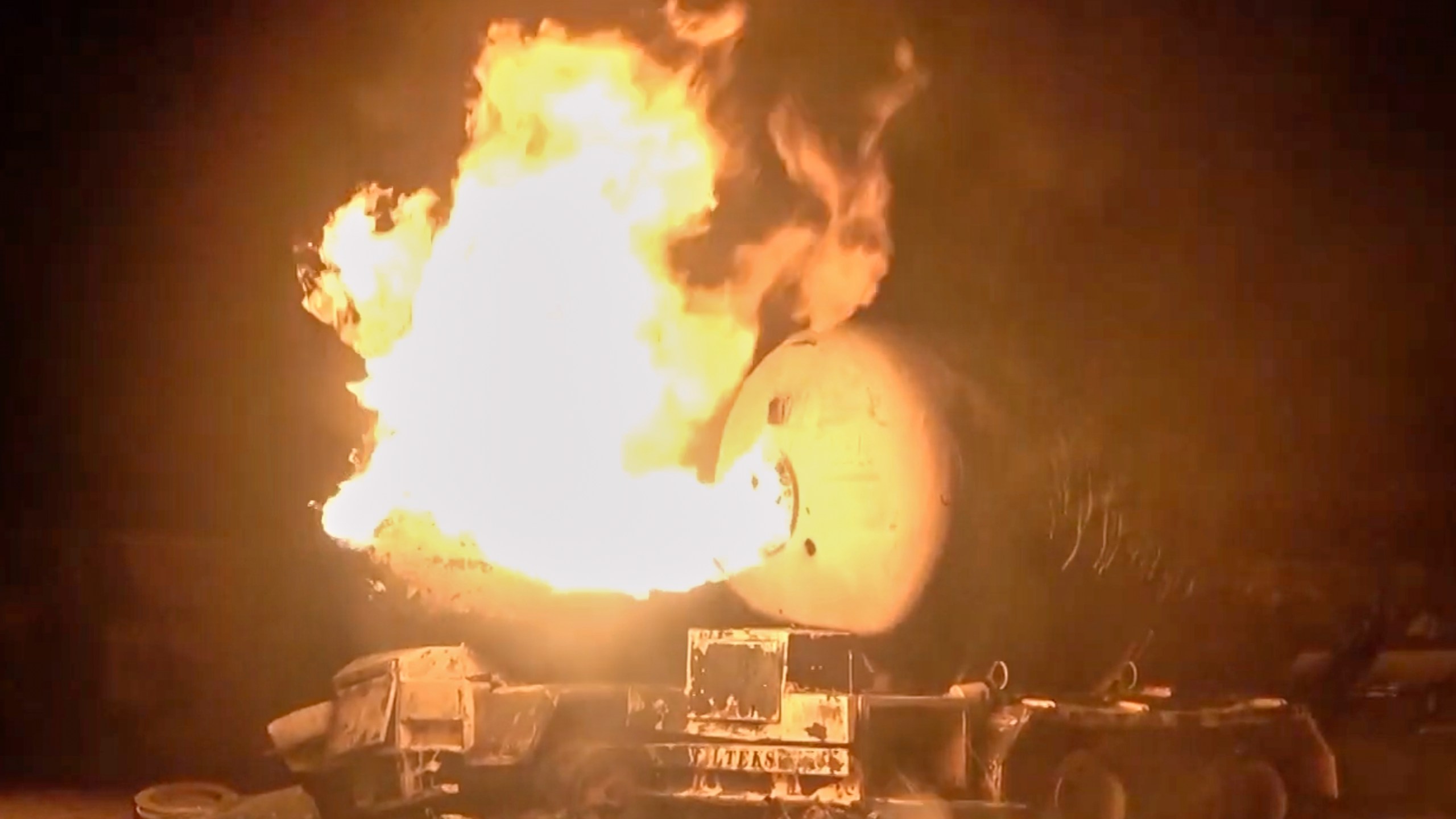 In this photo taken from video released by Al Masirah TV channel shows a burning oil tanker after U.S. airstrikes targeted the Ras Isa oil port held by Yemen's Houthi rebels in Hodeida, Yemen, Friday, April 18, 2025.( Al Masirah TV via AP)