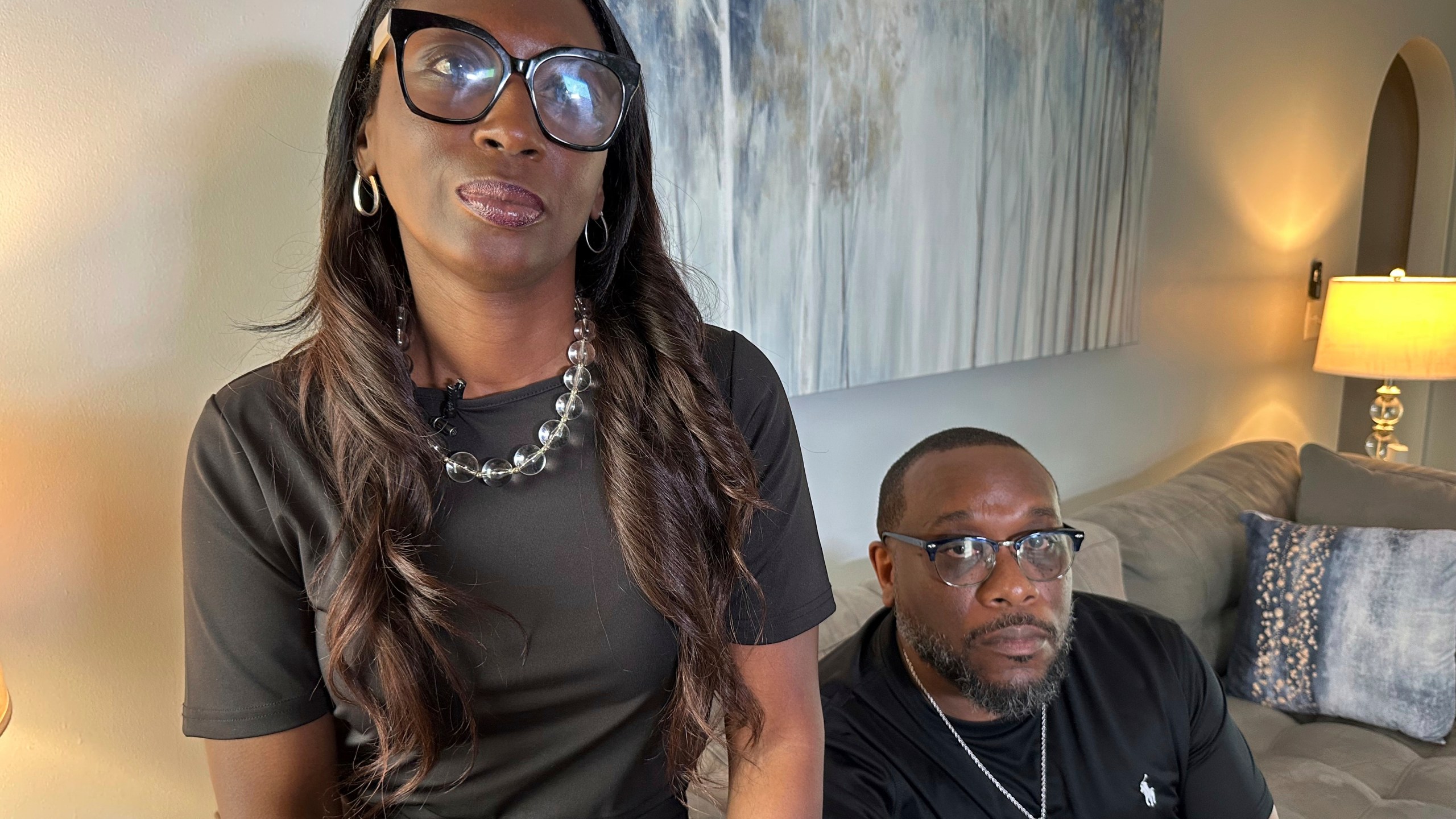 Trina Martin, left, and Toi Cliatt sit for a portrait inside the home the FBI mistakenly raided in 2017, in Atlanta on Friday, April 25, 2025. (AP Photo/Sudhin Thanawala)