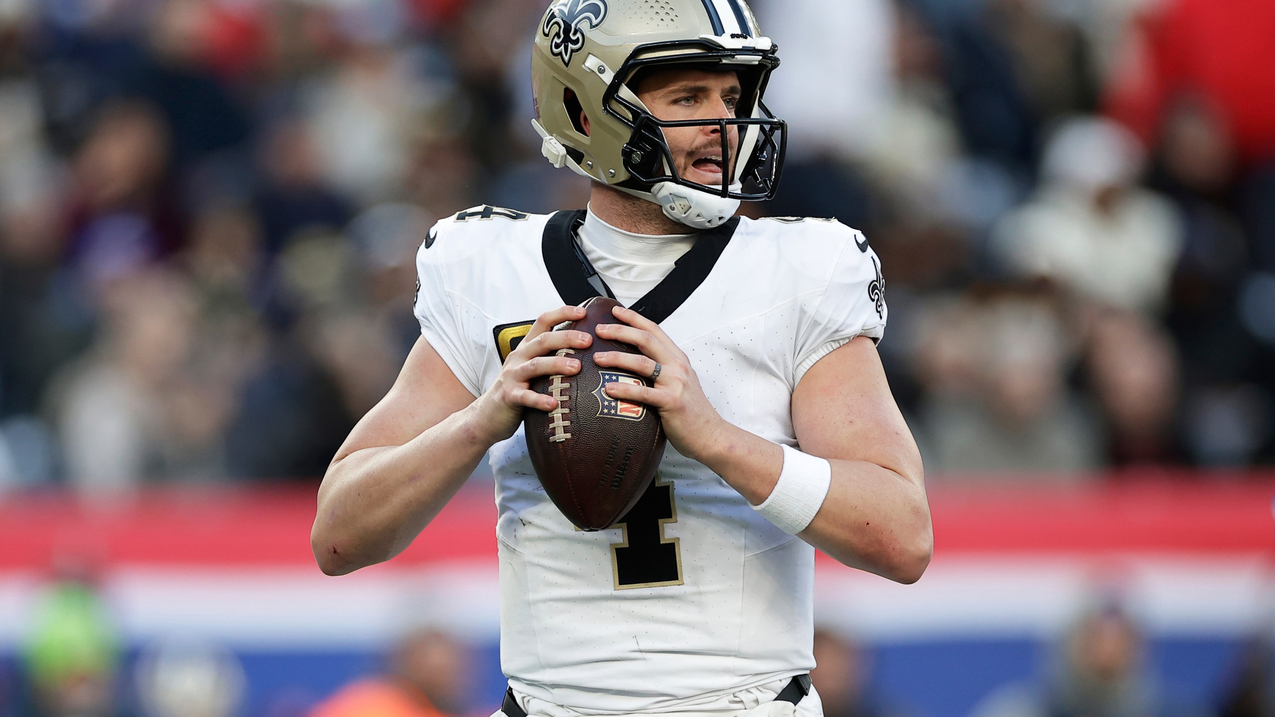 FILE - New Orleans Saints quarterback Derek Carr (4) looks to pass the ball during an NFL football game against the New York Giants, Dec. 8, 2024, in East Rutherford, N.J. (AP Photo/Adam Hunger, File)