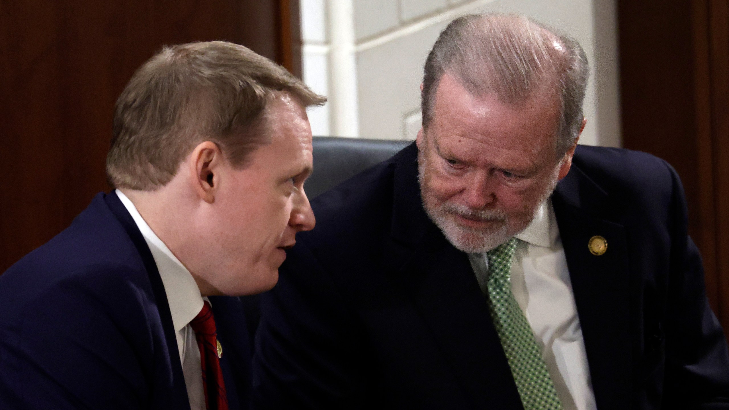 FILE - Speaker of the House Destin Hall, R-Caldwell, left, and Senate leader Phil Berger, R-Rockingham, right, confer before North Carolina Gov. Josh Stein, not pictured, delivers the State of the State address at the Legislative Building, Wednesday, March 12, 2025, in Raleigh N.C. (AP Photo/Chris Seward, File)