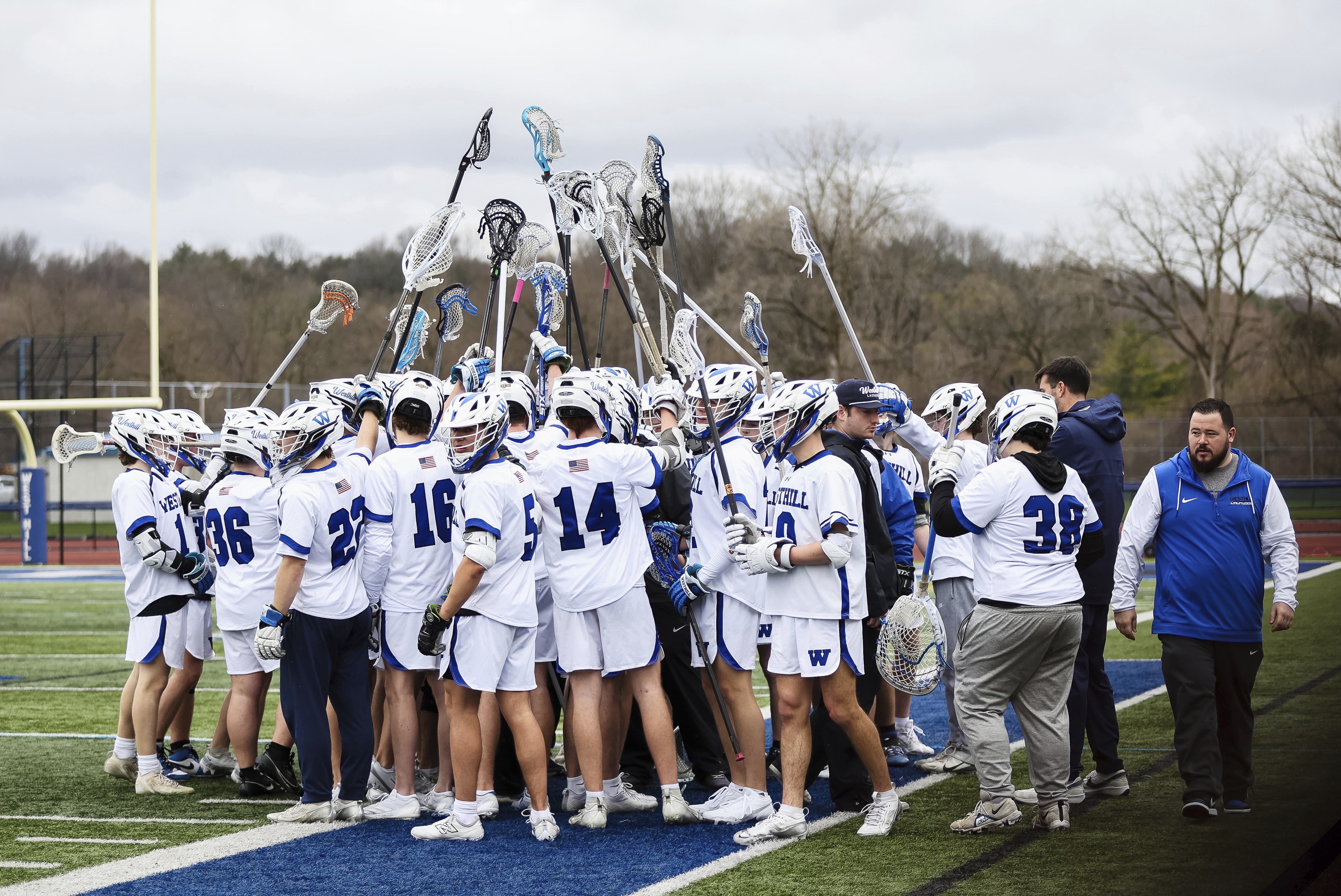 The Westhill boys lacrosse team huddles up during a matchup against General Brown at Westhill High School, Saturday, April 12, 2025 in Syracuse, N.Y. (Lia Garnes/Syracuse.com via AP)