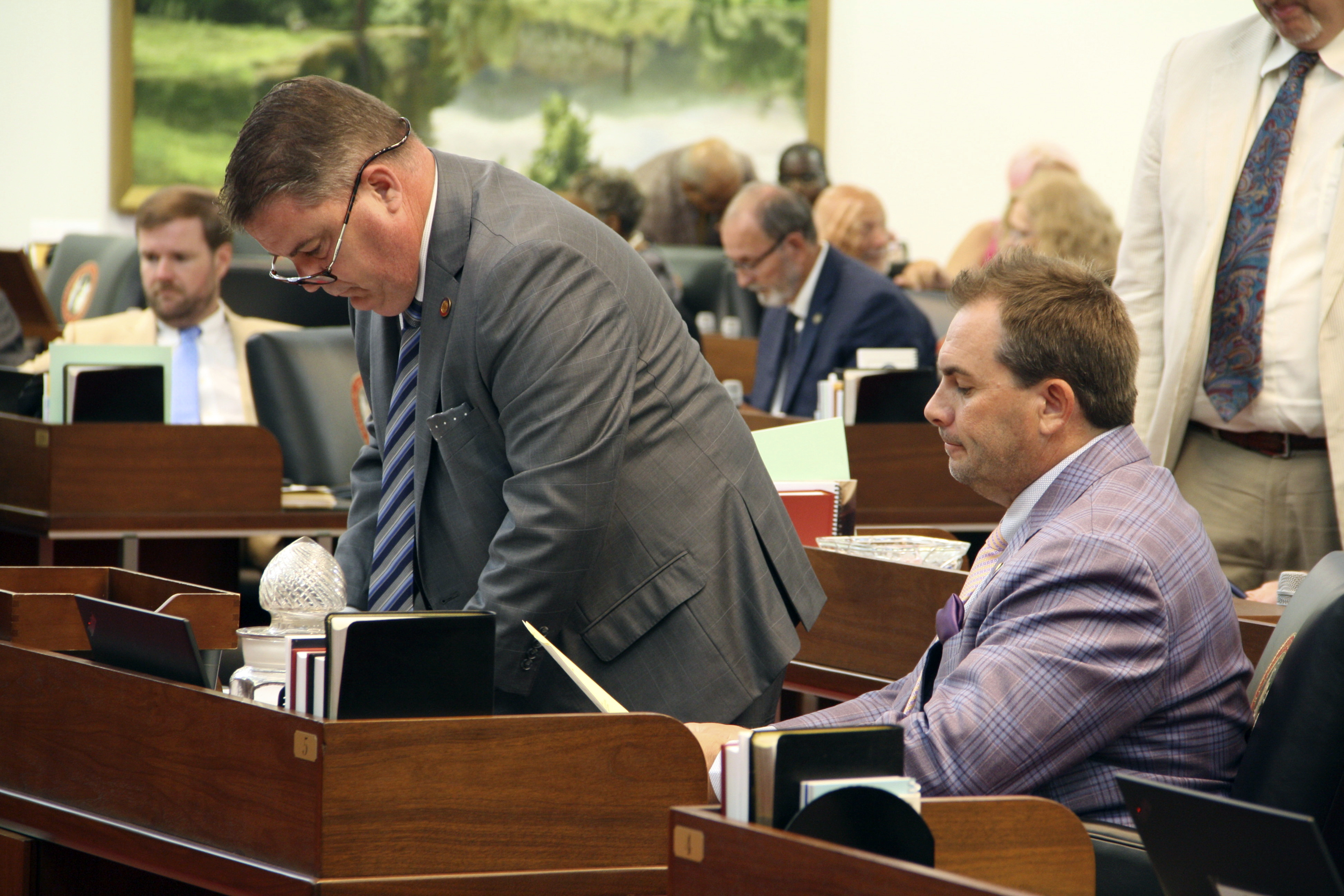 FILE - Rep. Brenden Jones, R-Columbus, stands beside Rep. John Bell, R-Wayne, at his desk ahead of extensive debate on the House floor at the Legislative Building in Raleigh, N.C., on Wednesday, June 26, 2024. (AP Photo/Makiya Seminera, File)