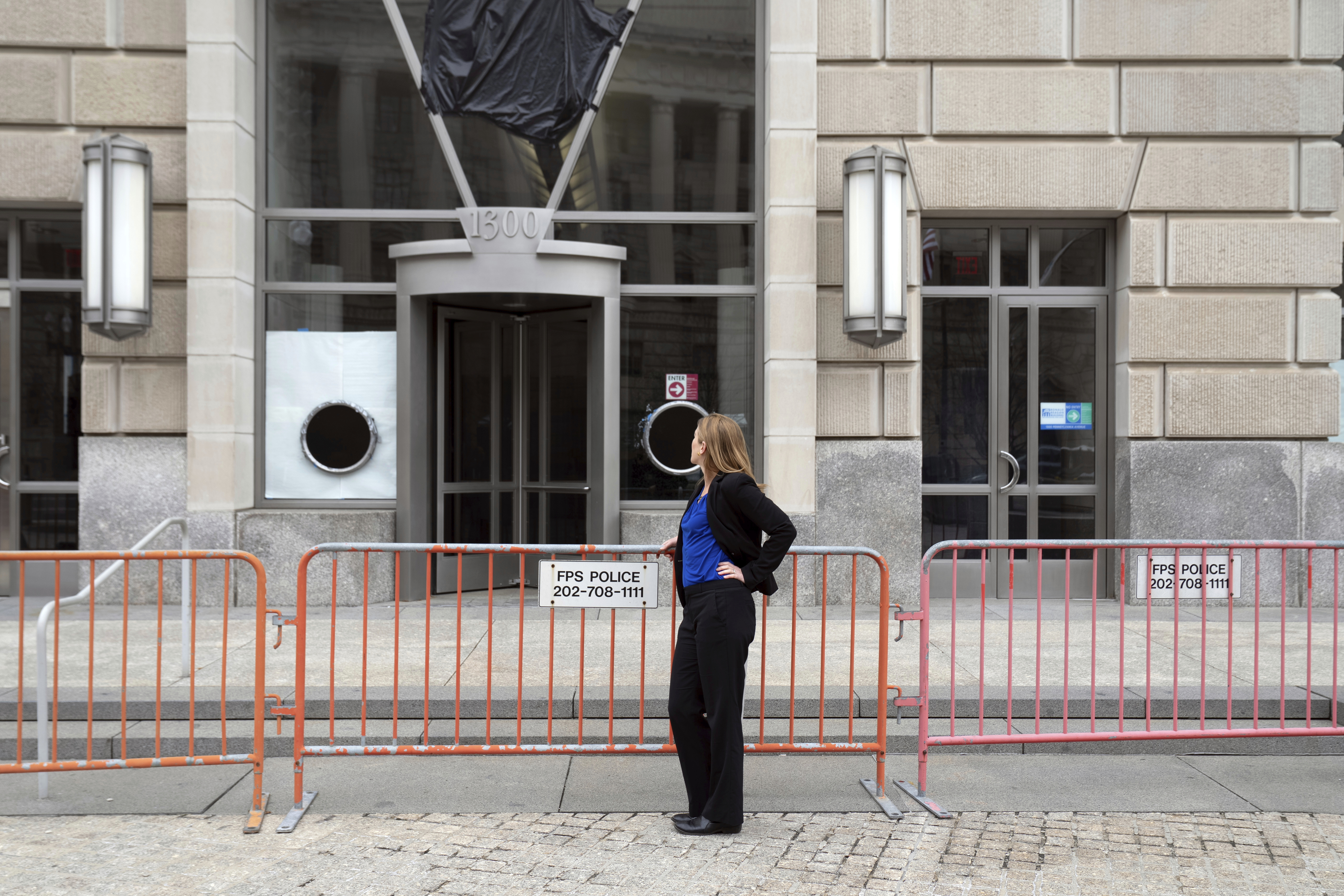Laura Meissner stands in front of the United States Agency for International Development (USAID) headquarters, Wednesday, April 2, 2025, in Washington. (AP Photo/Rahmat Gul)