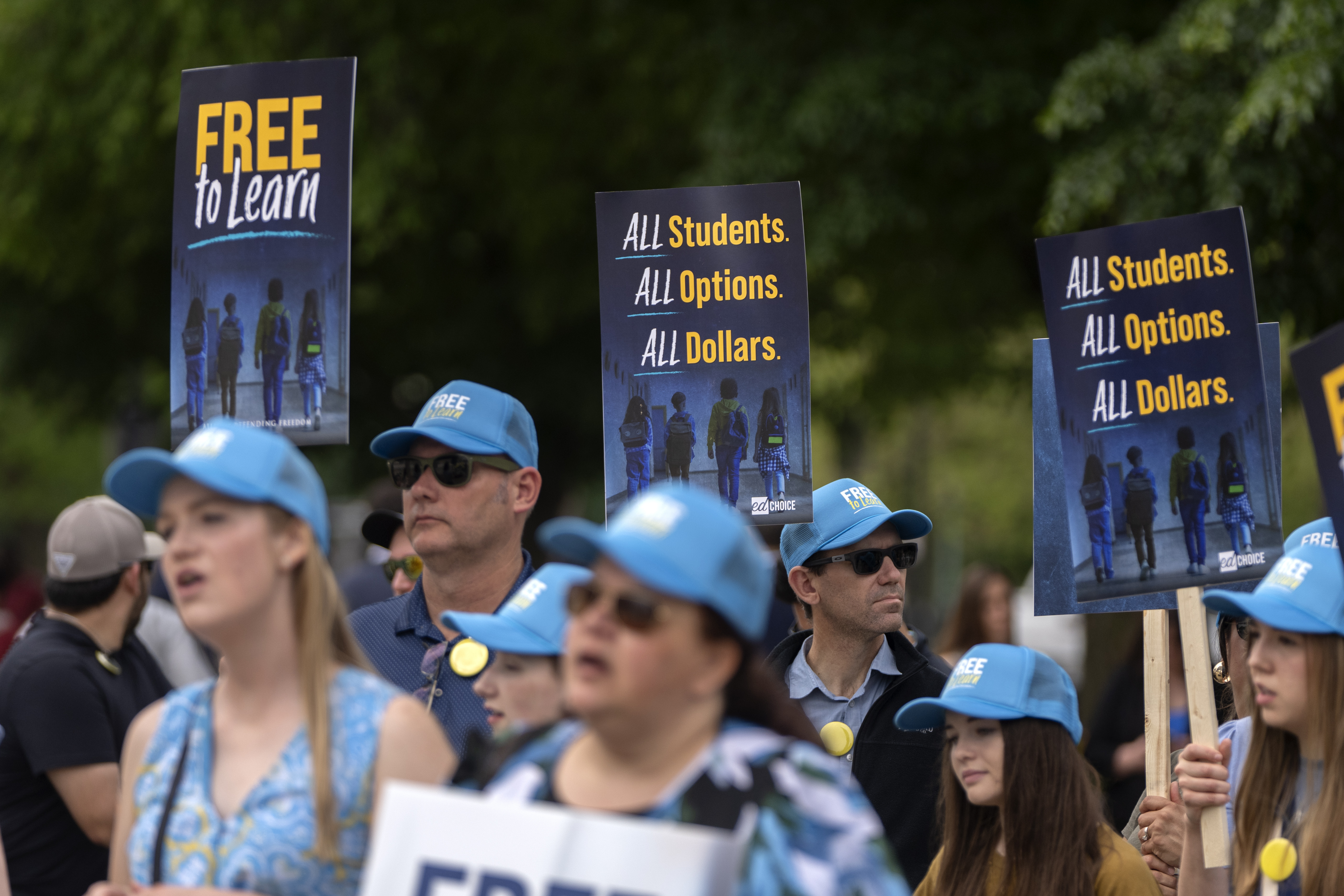 Supporters of charter schools rally outside of the Supreme Court on Wednesday, April 30, 2025, in Washington. (AP Photo/Mark Schiefelbein)
