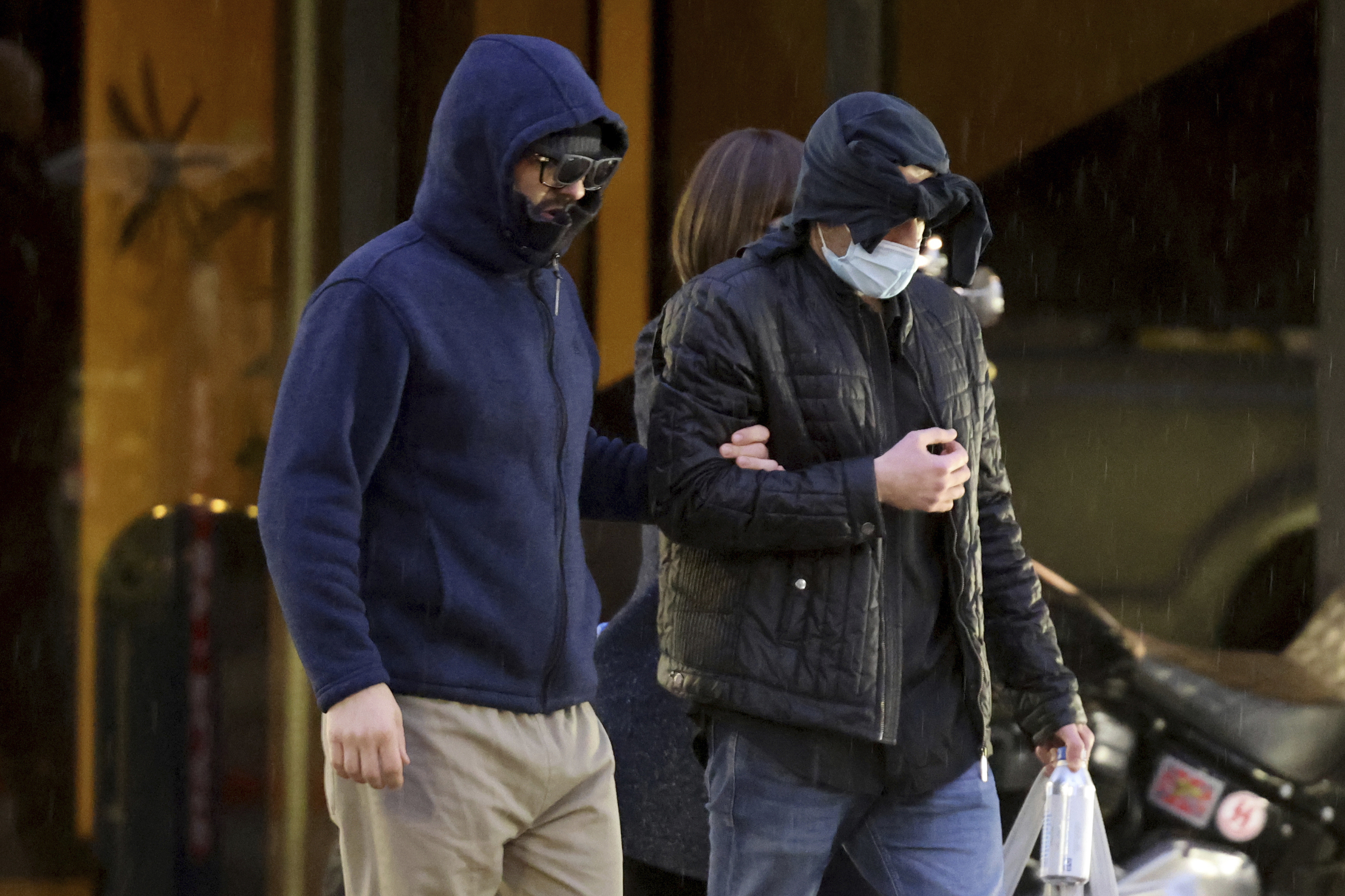 FILE - Former FBI informant Alexander Smirnov, left, walks out of his lawyer's office in downtown Las Vegas after being released from federal custody on Feb. 20, 2024. (K.M. Cannon/Las Vegas Review-Journal via AP, File)