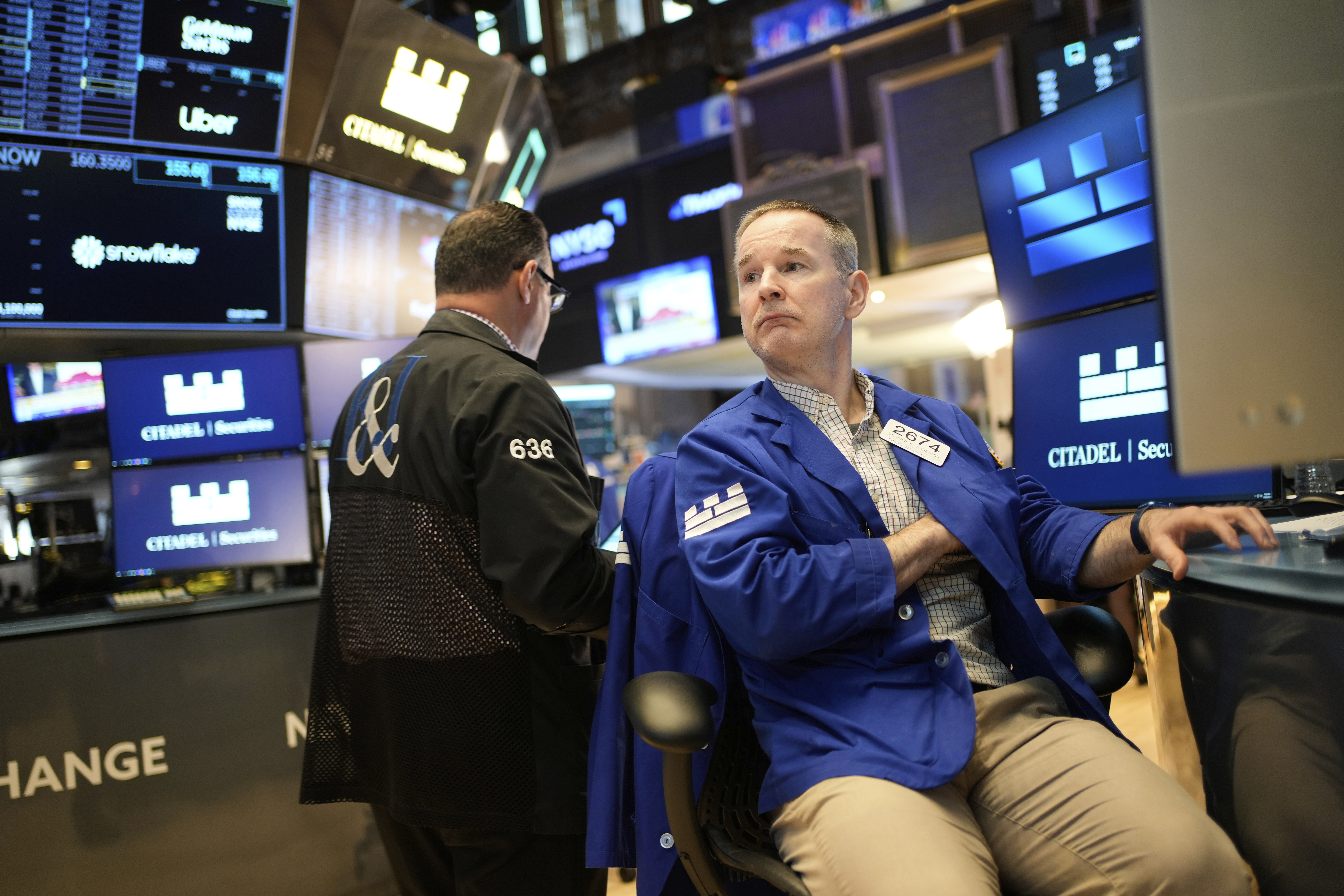 Stephen Naughton works on the floor at the New York Stock Exchange in New York, Wednesday, April 30, 2025. (AP Photo/Seth Wenig)