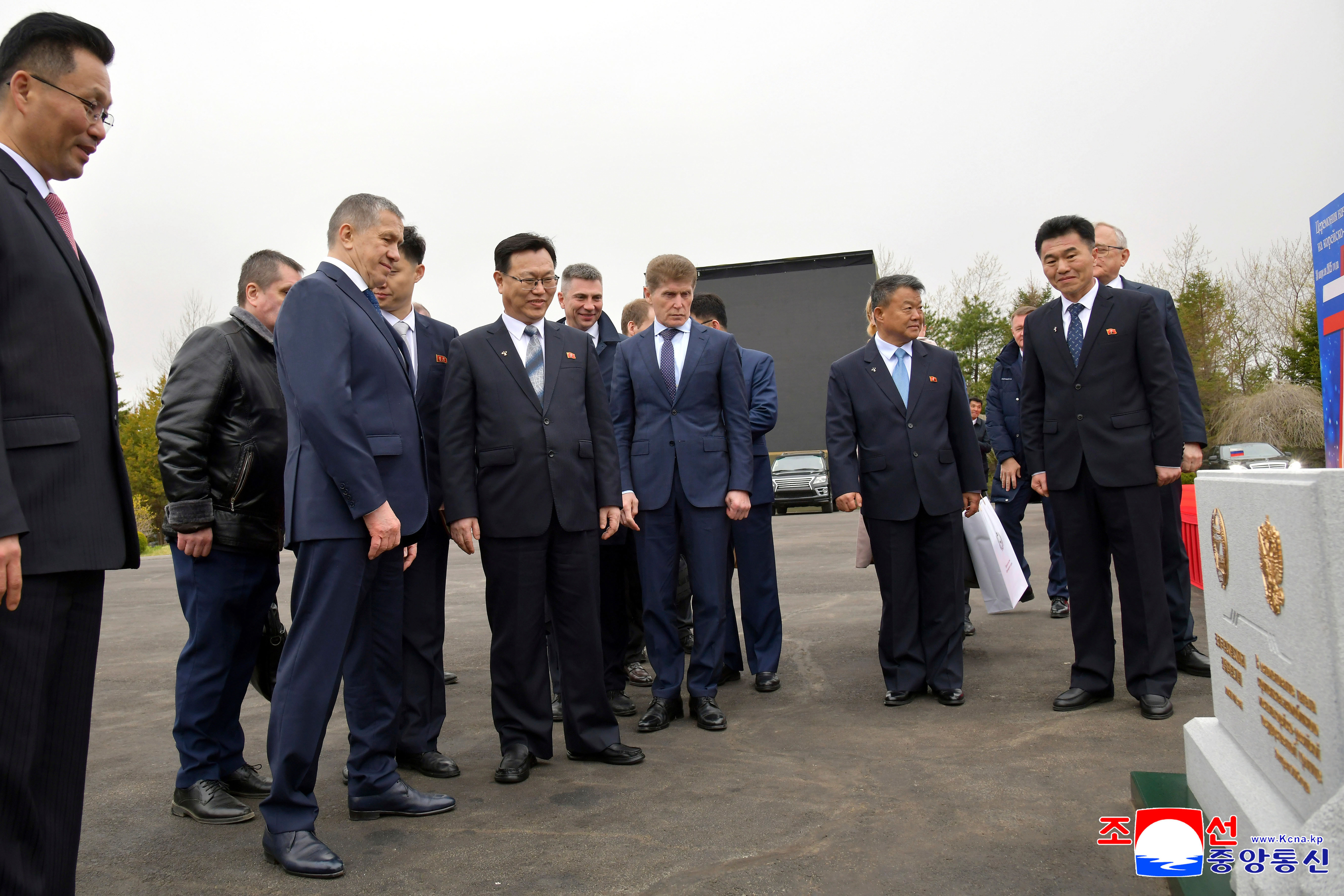 In this photo provided by the North Korean government, officials from North Korean and Russia stand in front of a monument to mark a ground-breaking ceremony for the construction of a bridge between the two countries, in Rason Municipality, North Kora Wednesday, April 30, 2025. Persons are not identified. Independent journalists were not given access to cover the event depicted in this image distributed by the North Korean government. The content of this image is as provided and cannot be independently verified. Korean language watermark on image as provided by source reads: "KCNA" which is the abbreviation for Korean Central News Agency. (Korean Central News Agency/Korea News Service via AP)