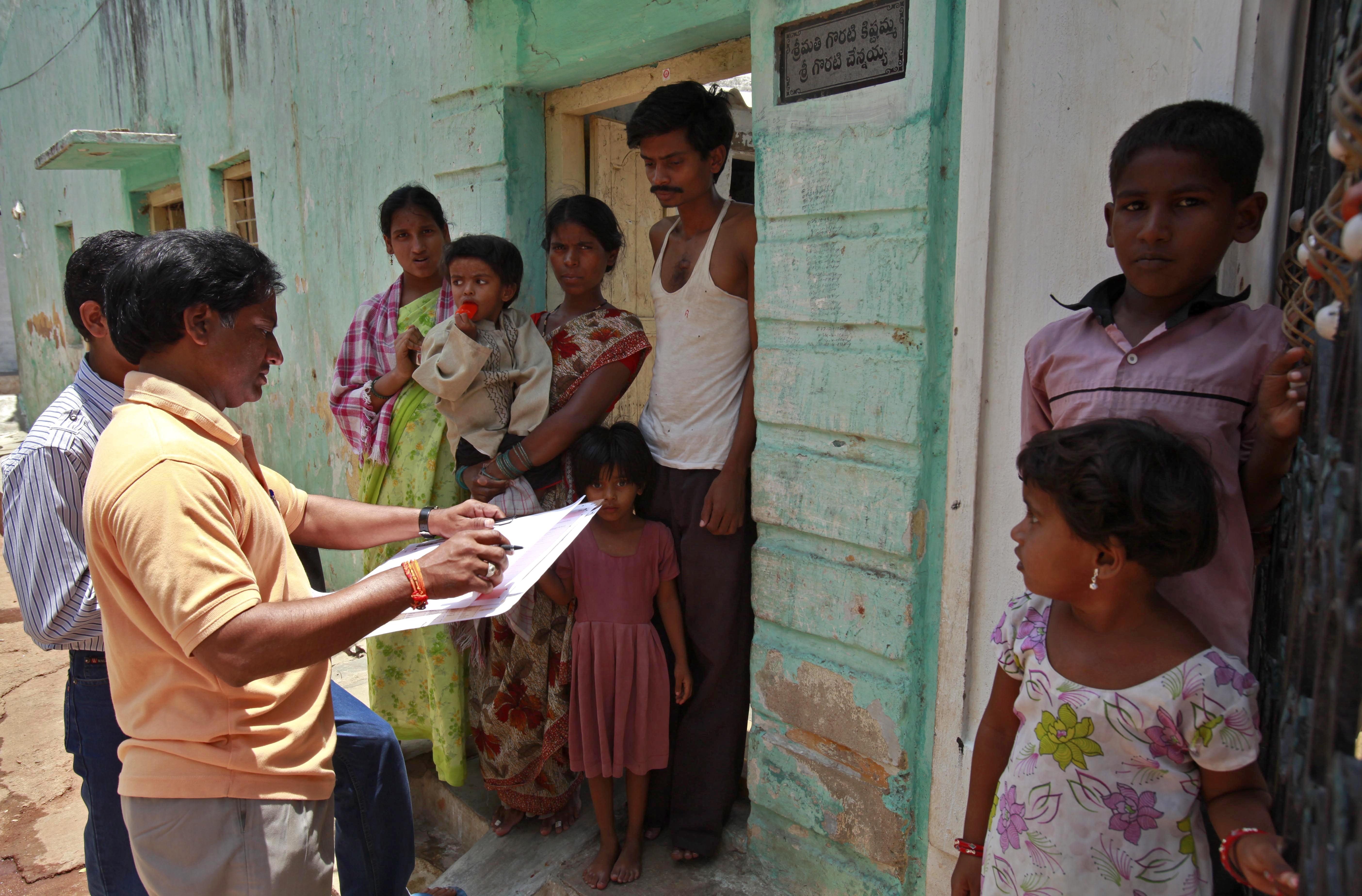 FILE -A census officer collects details of a family in Hyderabad, India, May 11, 2010. (AP Photo/Mahesh Kumar A, File)