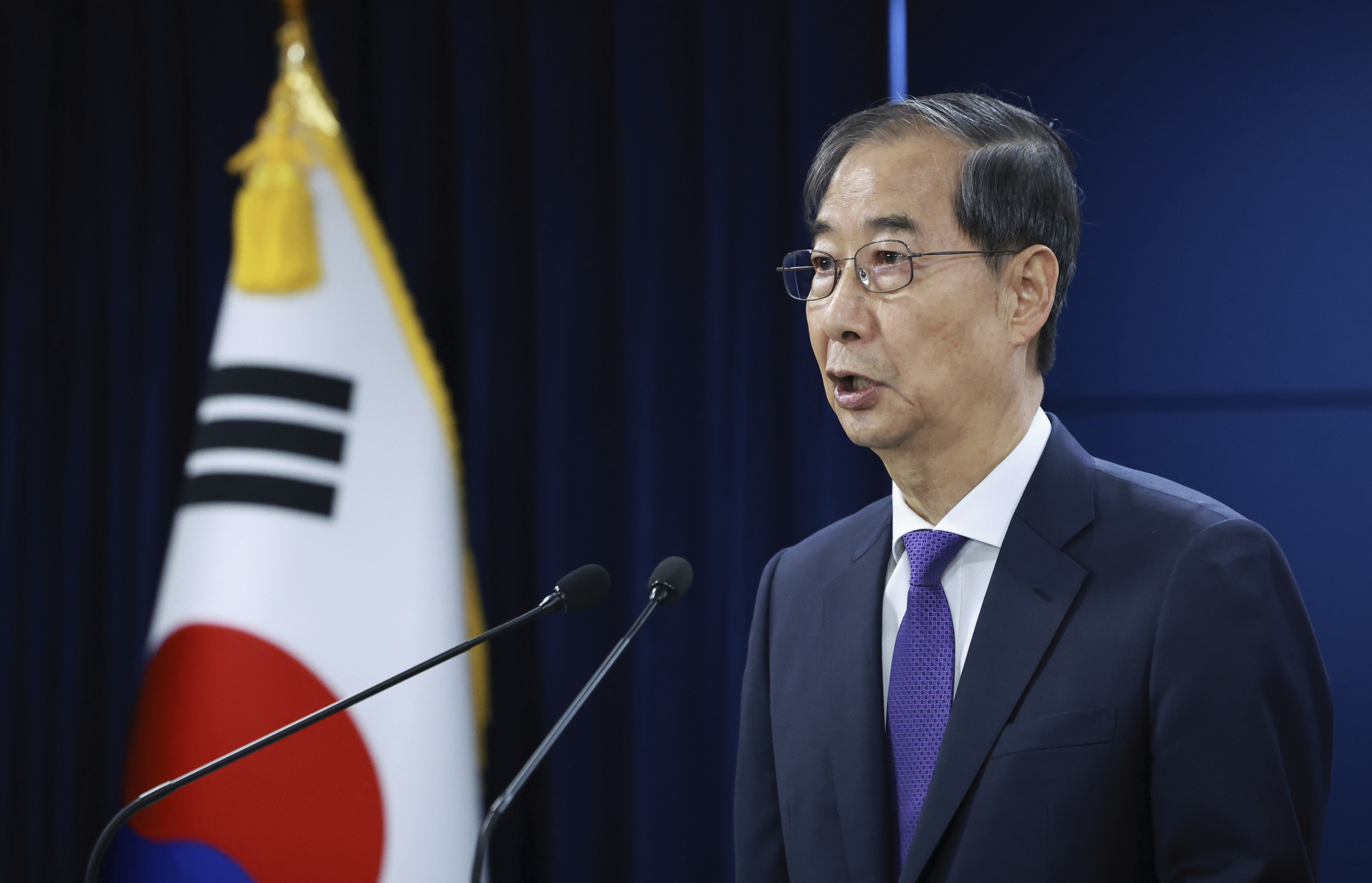 South Korean acting President Han Duck-soo speaks during a press conference at the Government Complex in Seoul, South Korea, Thursday, May 1, 2025. (Hong Hae-in/Yonhap via AP)