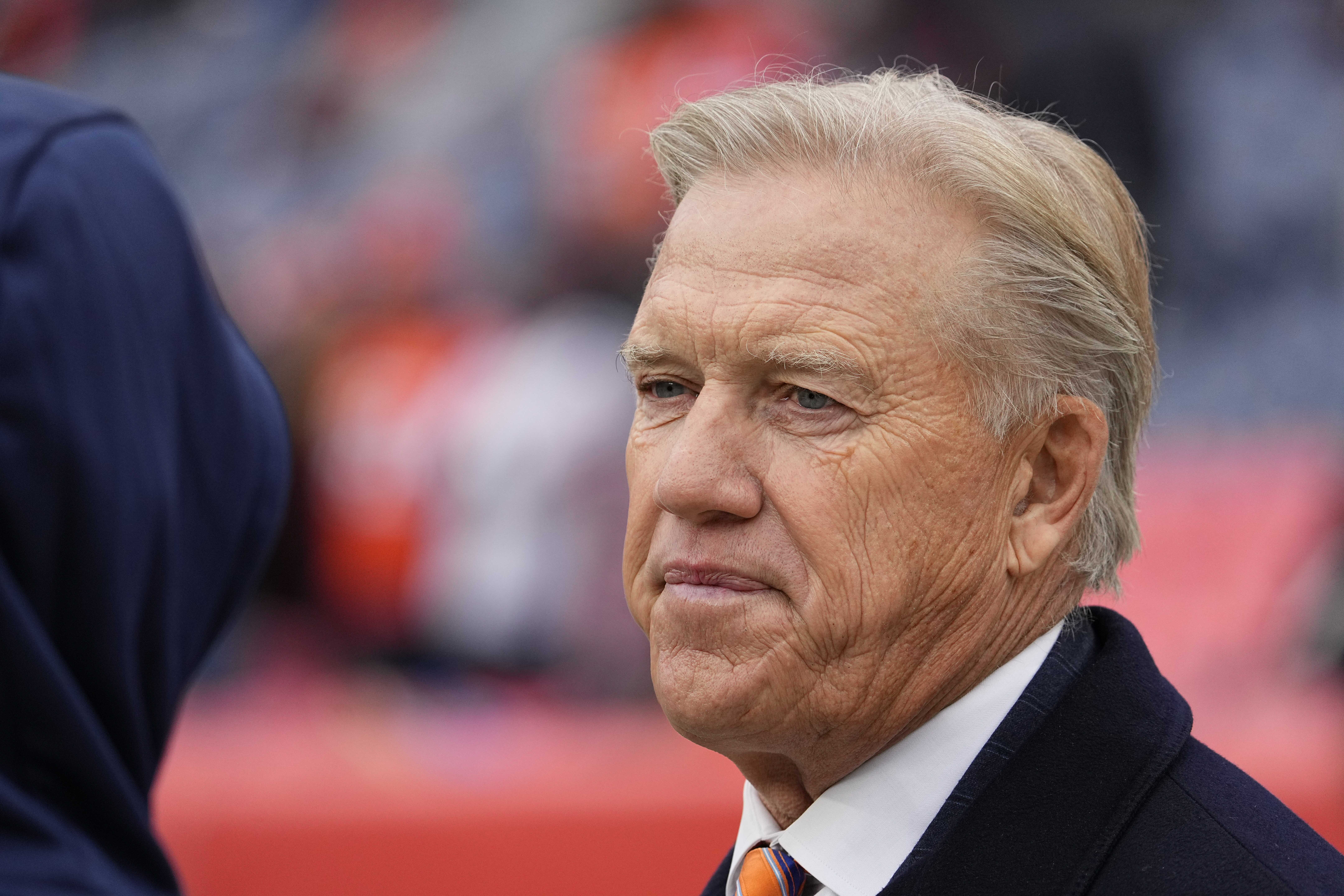 FILE - John Elway, Denver Broncos president of football operations, looks on before an NFL football game against the Washington Football Team, Oct. 31, 2021, in Denver. (AP Photo/Jack Dempsey, File)