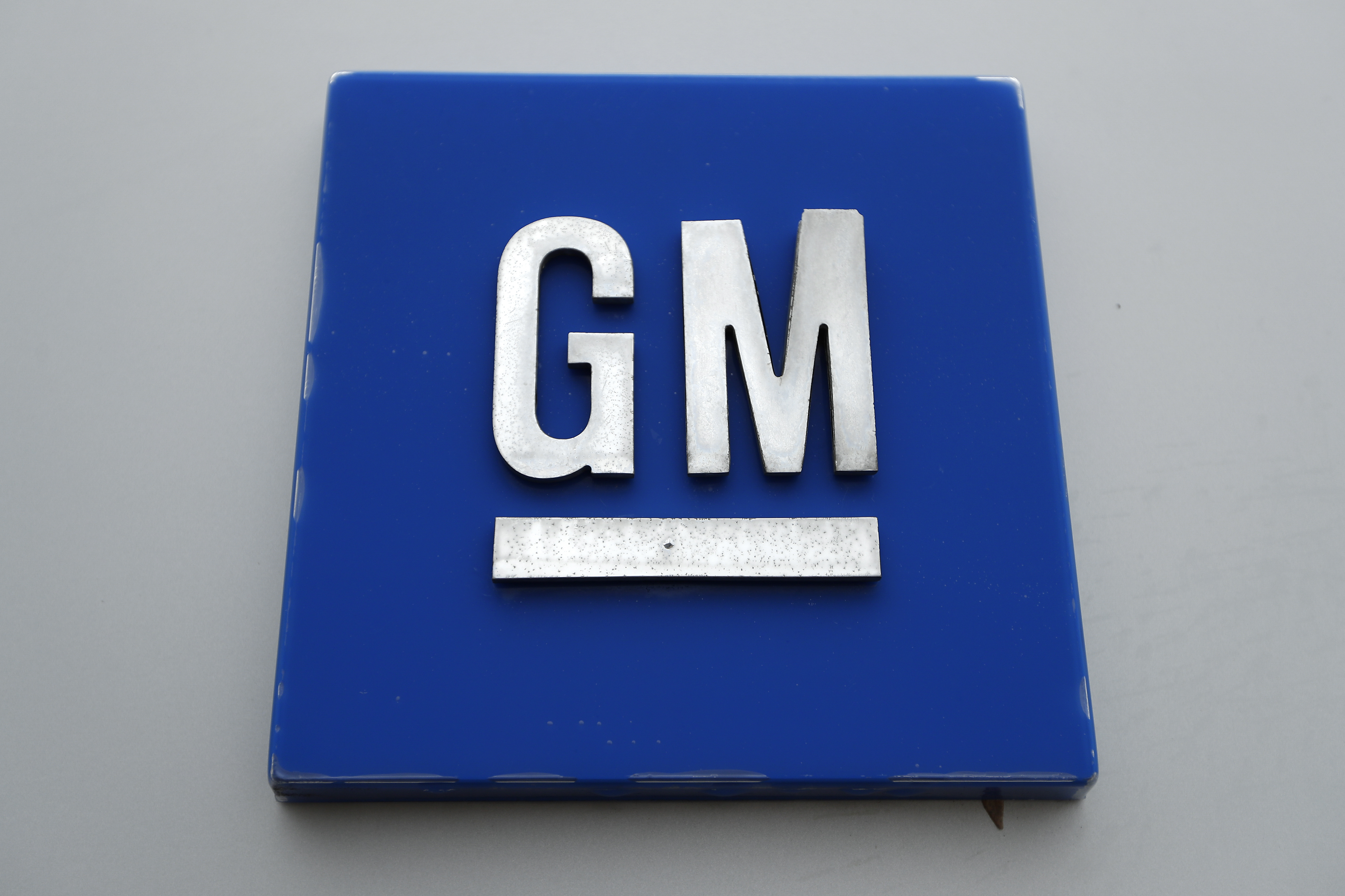 FILE - The General Motors logo is displayed at the General Motors Detroit-Hamtramck Assembly plant in Hamtramck, Mich., Jan. 27, 2020. (AP Photo/Paul Sancya, File)