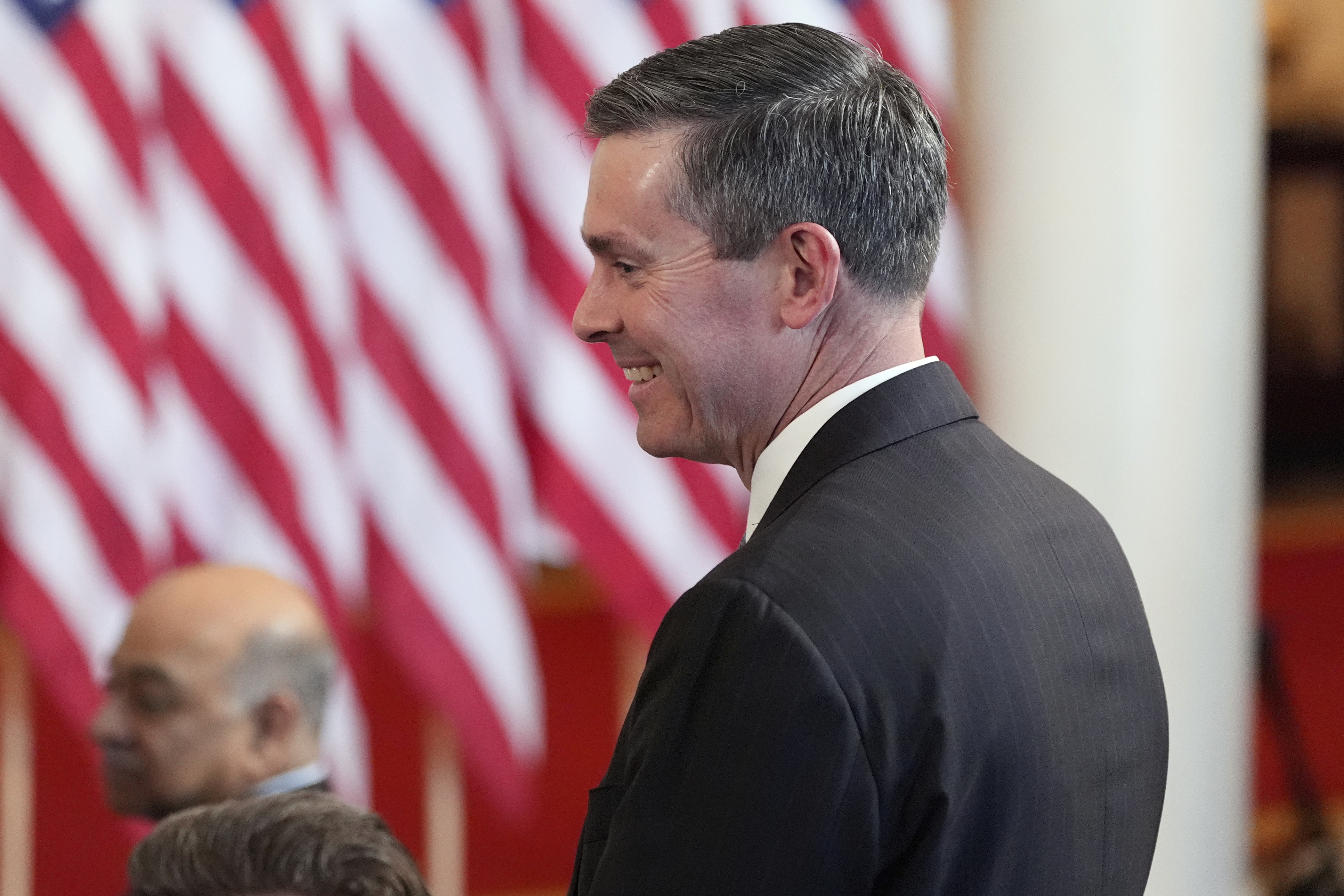 Eli Lilly and Company CEO David Ricks stands as President Donald Trump speaks about investing in America in the Cross Hall of the White House, Wednesday, April 30, 2025, in Washington. (AP Photo/Alex Brandon)