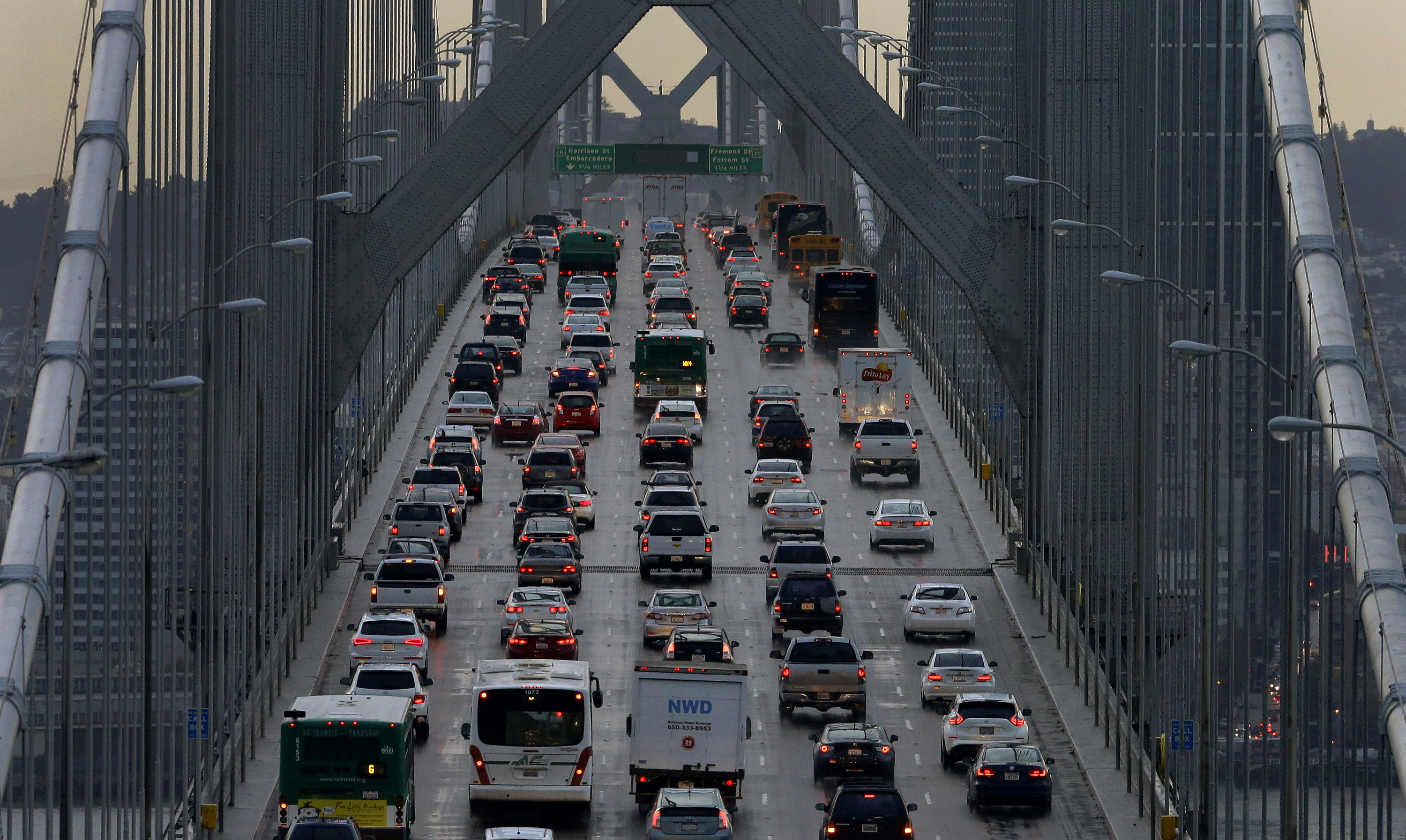 FILE - In this Dec. 10, 2015, file photo, vehicles make their way westbound on Interstate 80 across the San Francisco-Oakland Bay Bridge as seen from Treasure Island in San Francisco. (AP Photo/Ben Margot, File)