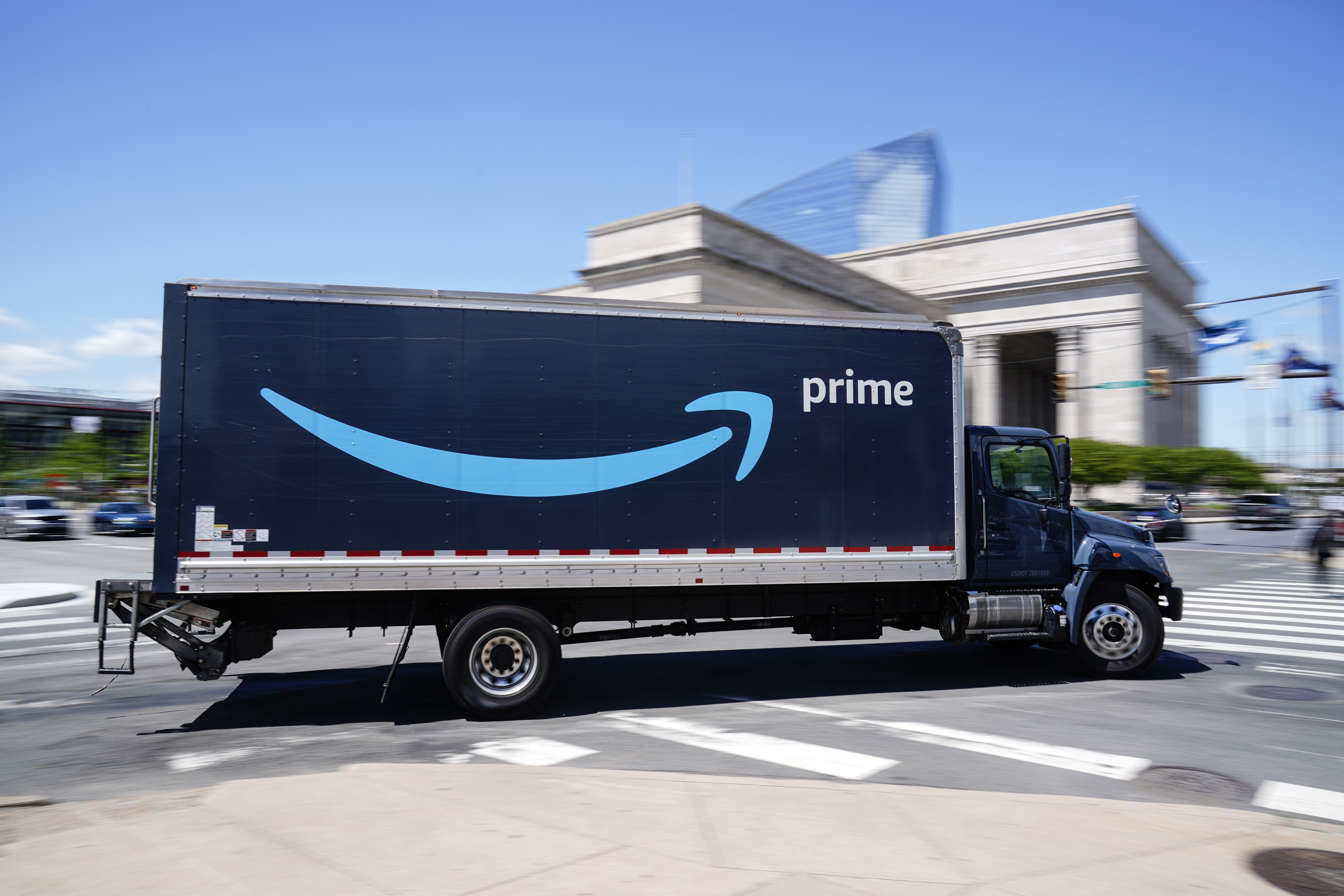FILE - An Amazon truck drives in in Philadelphia, Friday, April 30, 2021. (AP Photo/Matt Rourke, file)