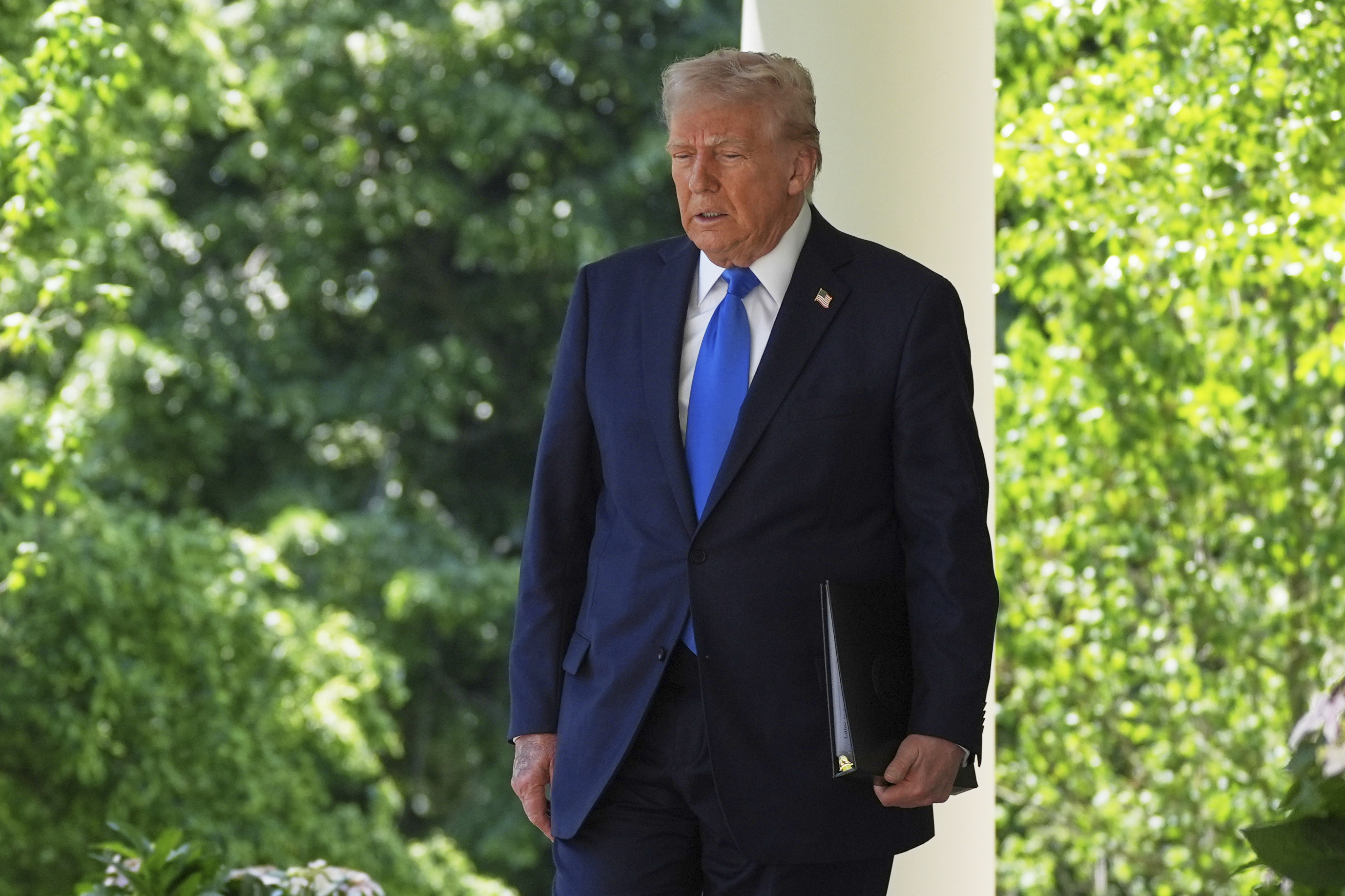President Donald Trump arrives to speak during a National Day of Prayer event in the Rose Garden of the White House, Thursday, May 1, 2025, in Washington. (AP Photo/Evan Vucci)