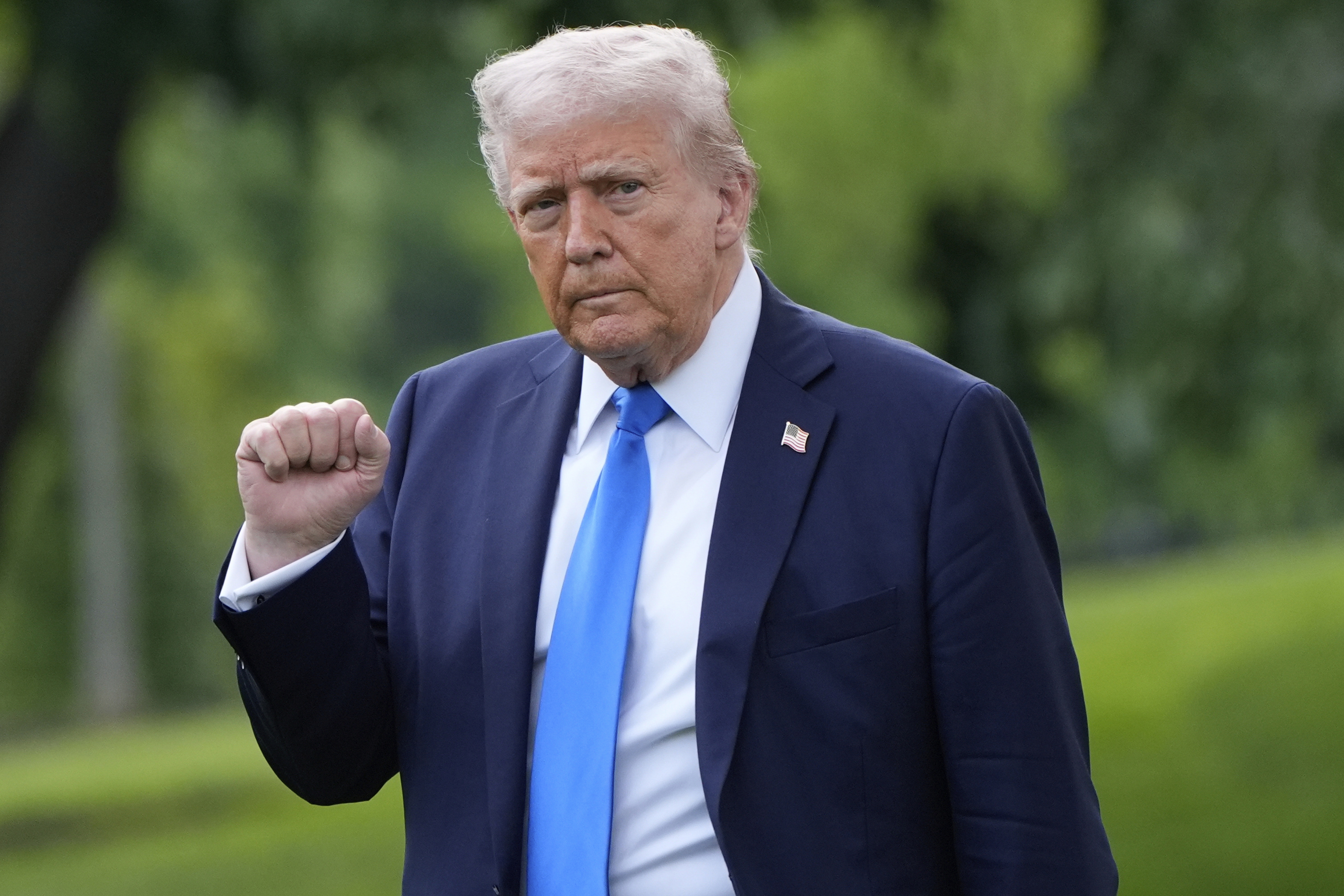 President Donald Trump gestures as he walks from the Oval Office to depart on Marine One from the South Lawn of the White House, Thursday, May 1, 2025, in Washington. (AP Photo/Alex Brandon)