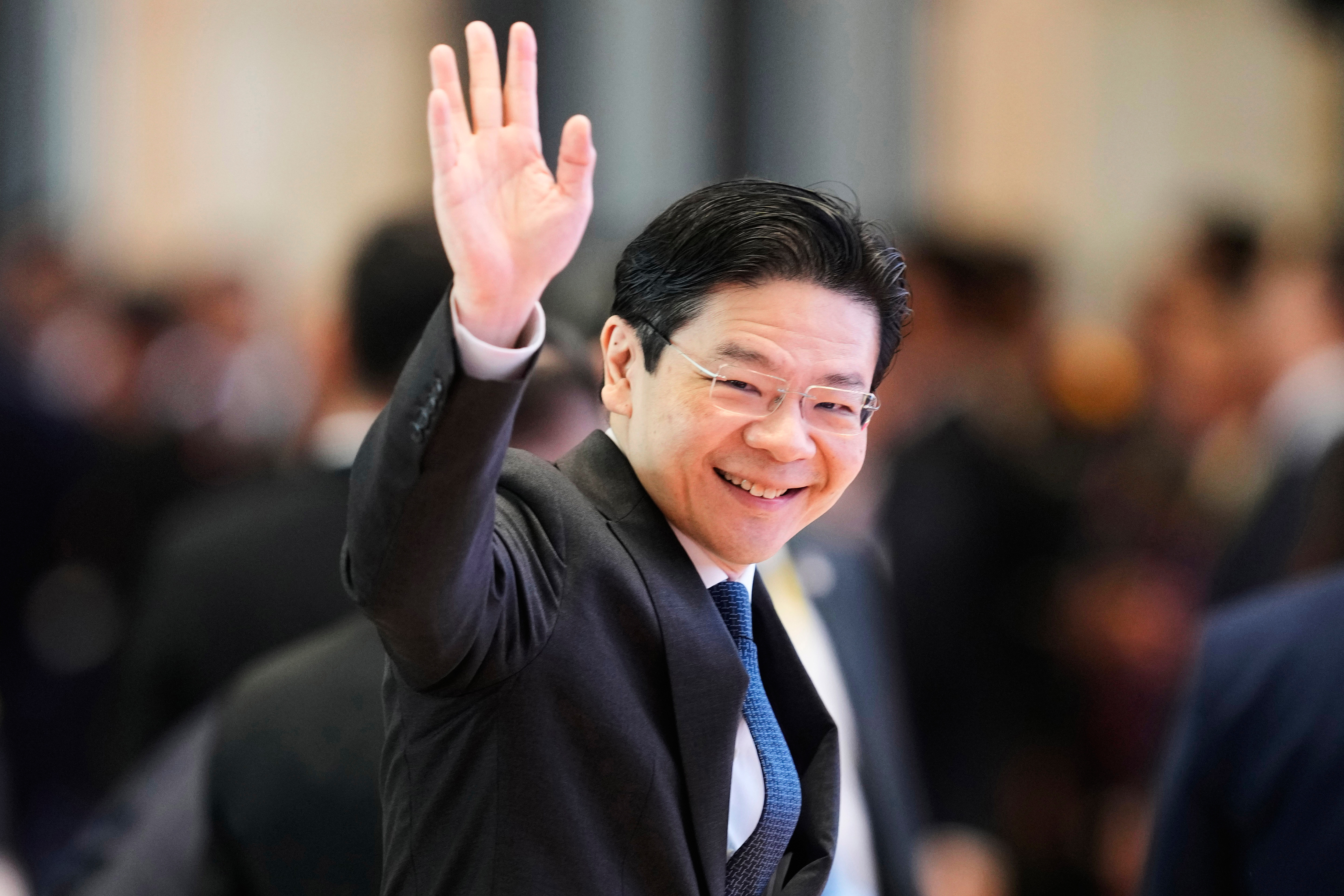 FILE - Singapore's Prime Minister Lawrence Wong arrives to participate in ASEAN-China summit in Vientiane, Laos, on Oct. 10, 2024. (AP Photo/Sakchai Lalit, File)