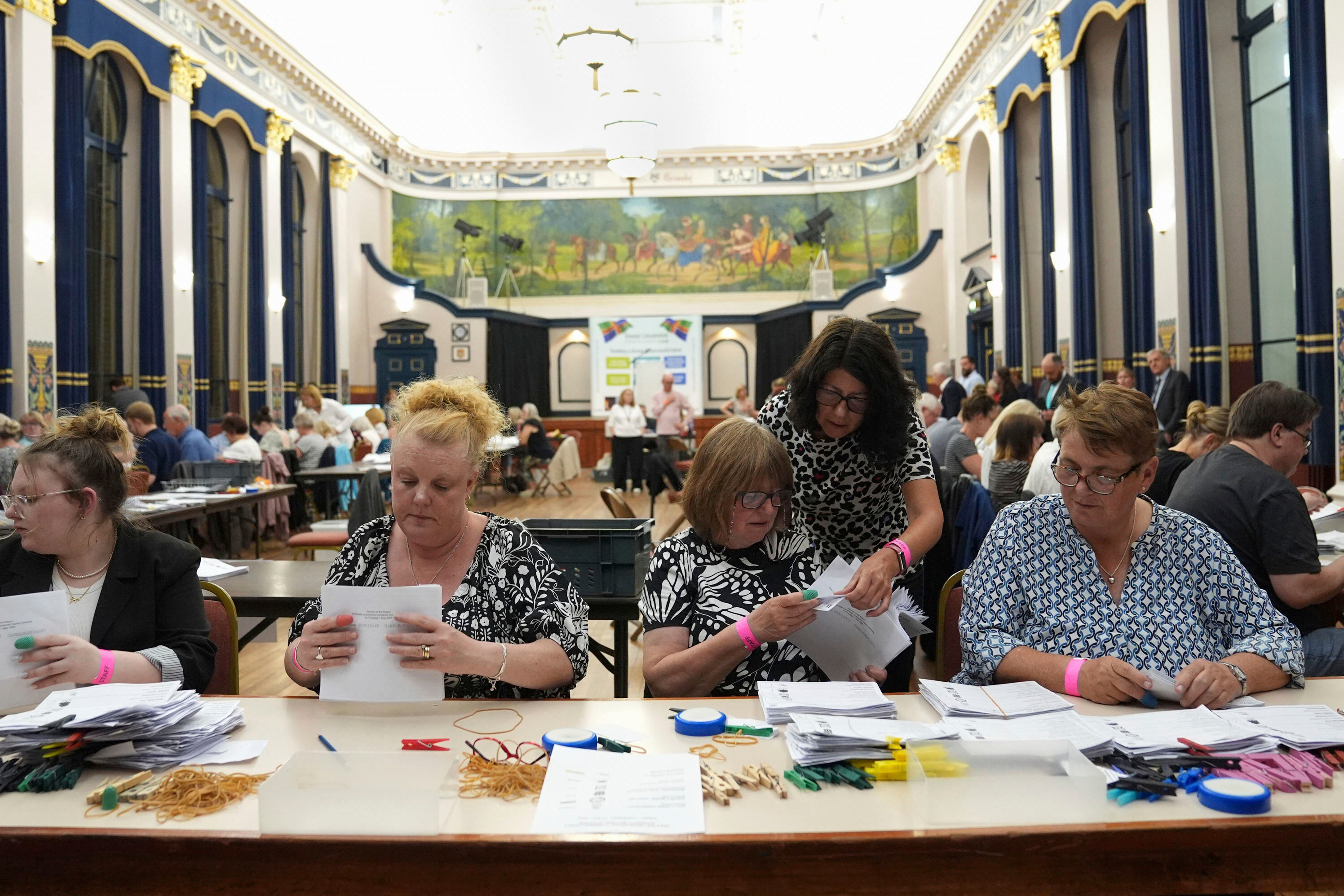 Votes are counted at Grimsby Town Hall, in Lincolnshire, England, for the Greater Lincolnshire Mayor election, early Friday, May 2, 2025. (Joe Giddens/PA via AP)