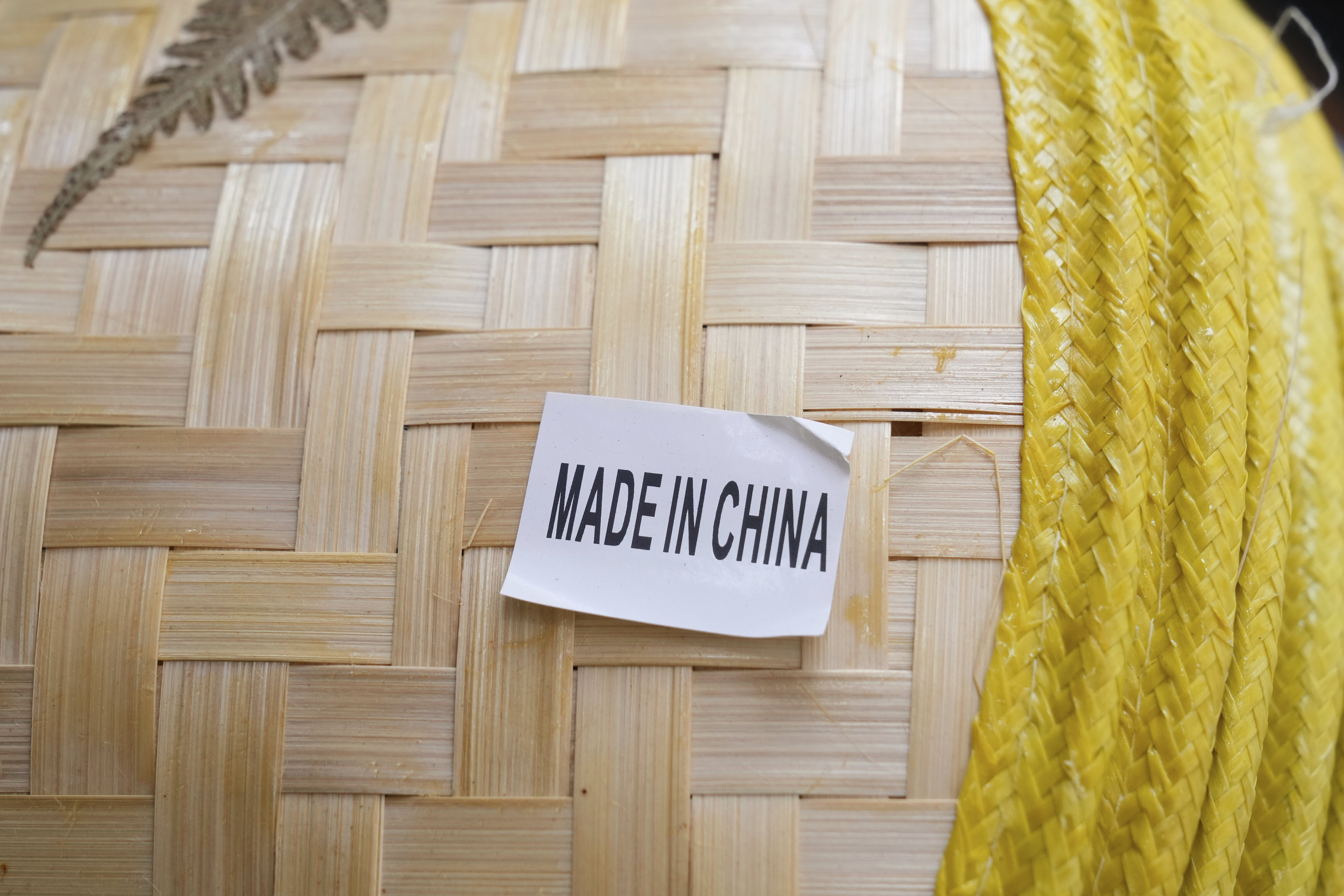 FILE - A made in China sticker is displayed on a hat at a store in Chinatown in San Francisco, April 18, 2025. (AP Photo/Jeff Chiu, File)