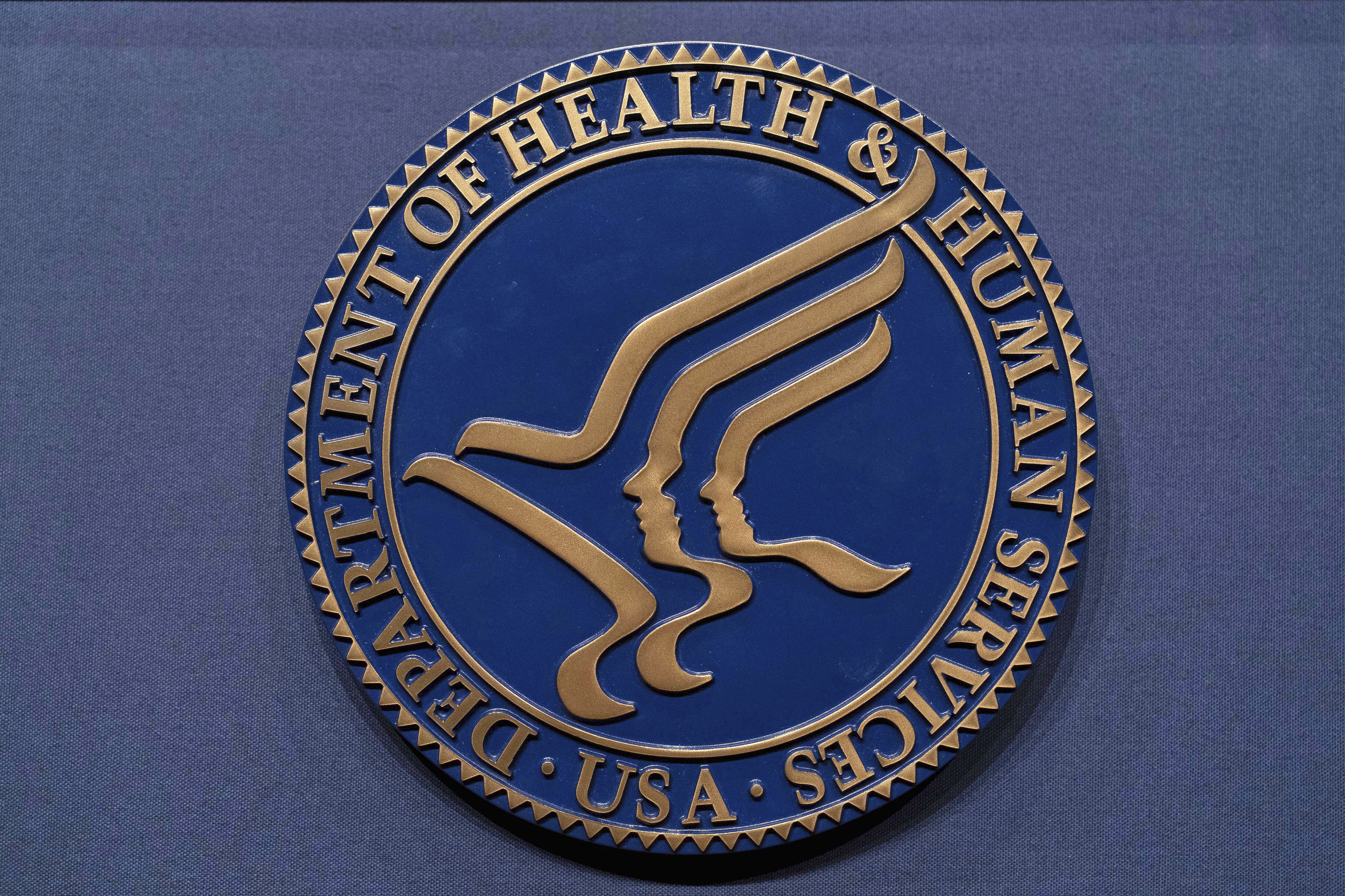 FILE - The Health and Human Services seal is seen before a news conference with Secretary Robert F. Kennedy Jr. in Washington, April 16, 2025. (AP Photo/Jose Luis Magana, File)