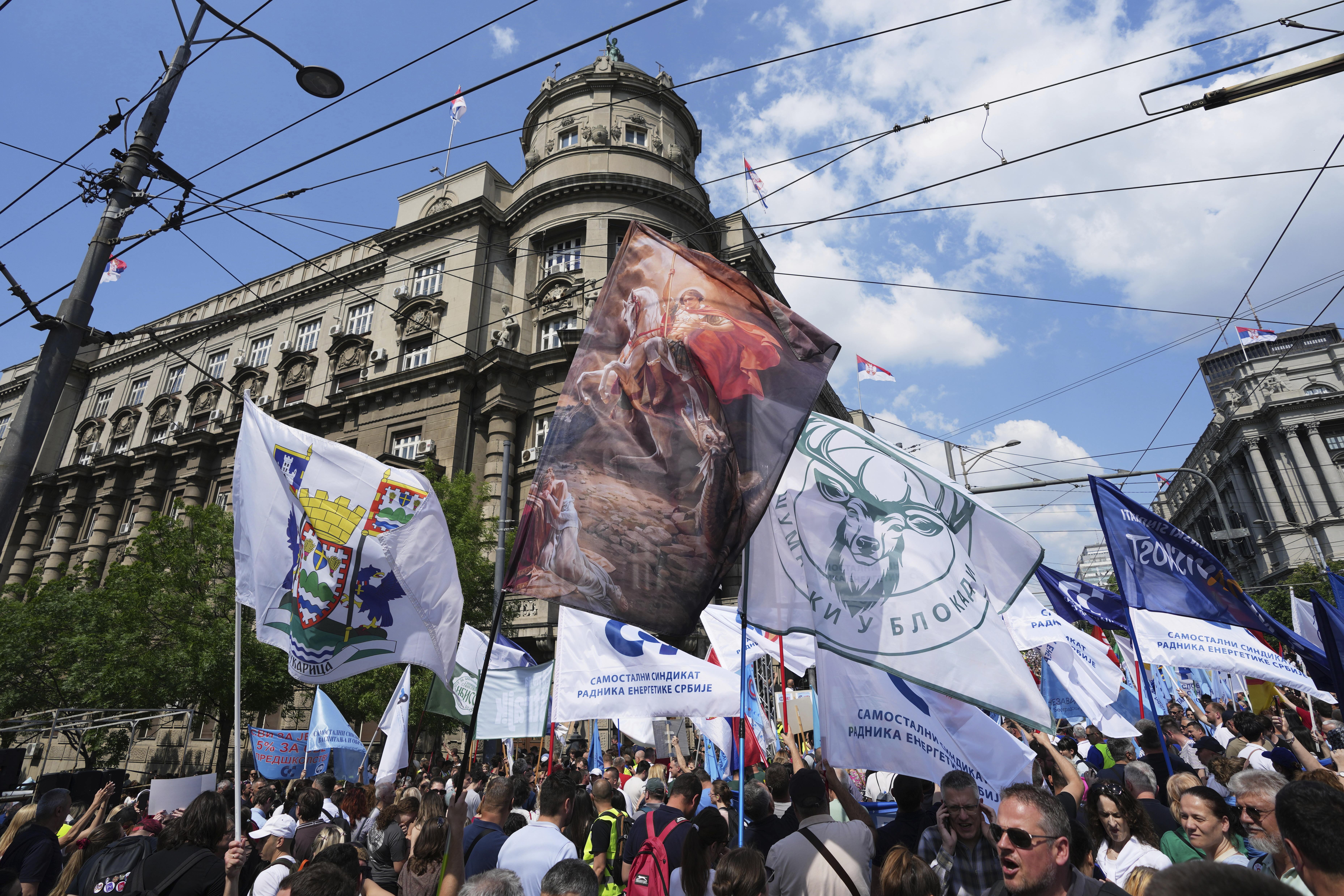 University students and people protest in front of the government building, six months after the deadly train station tragedy that sparked mass demonstrations against corruption, in Belgrade, Serbia, Thursday, May 1, 2025. (AP Photo/Darko Vojinovic)