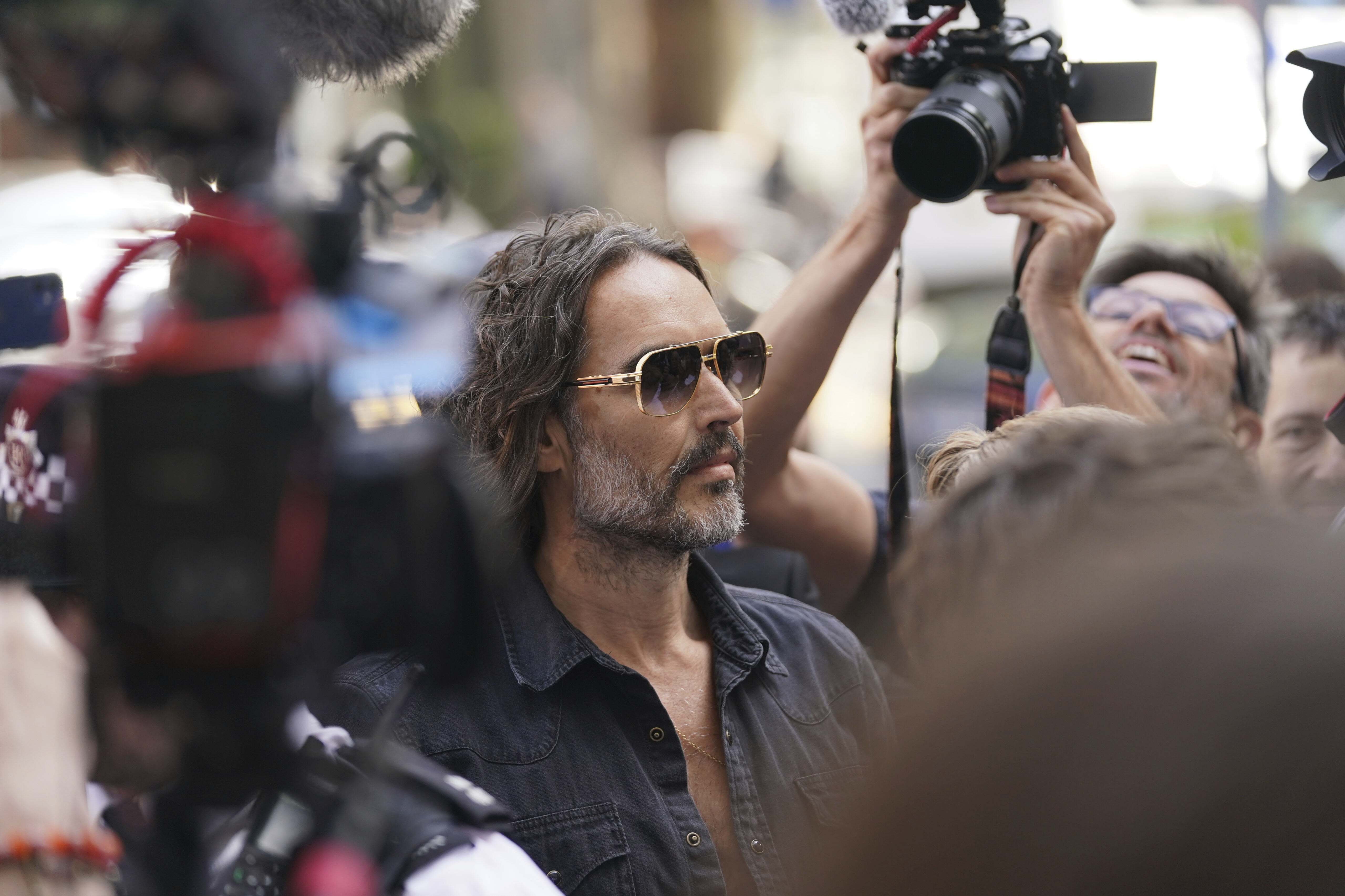 Actor--comedian Russell Brand arrives at Westminster Magistrates' court in London, Friday, May 2, 2025, to face charges of rape and sexual assault involving four women. (AP Photo/Alberto Pezzali)