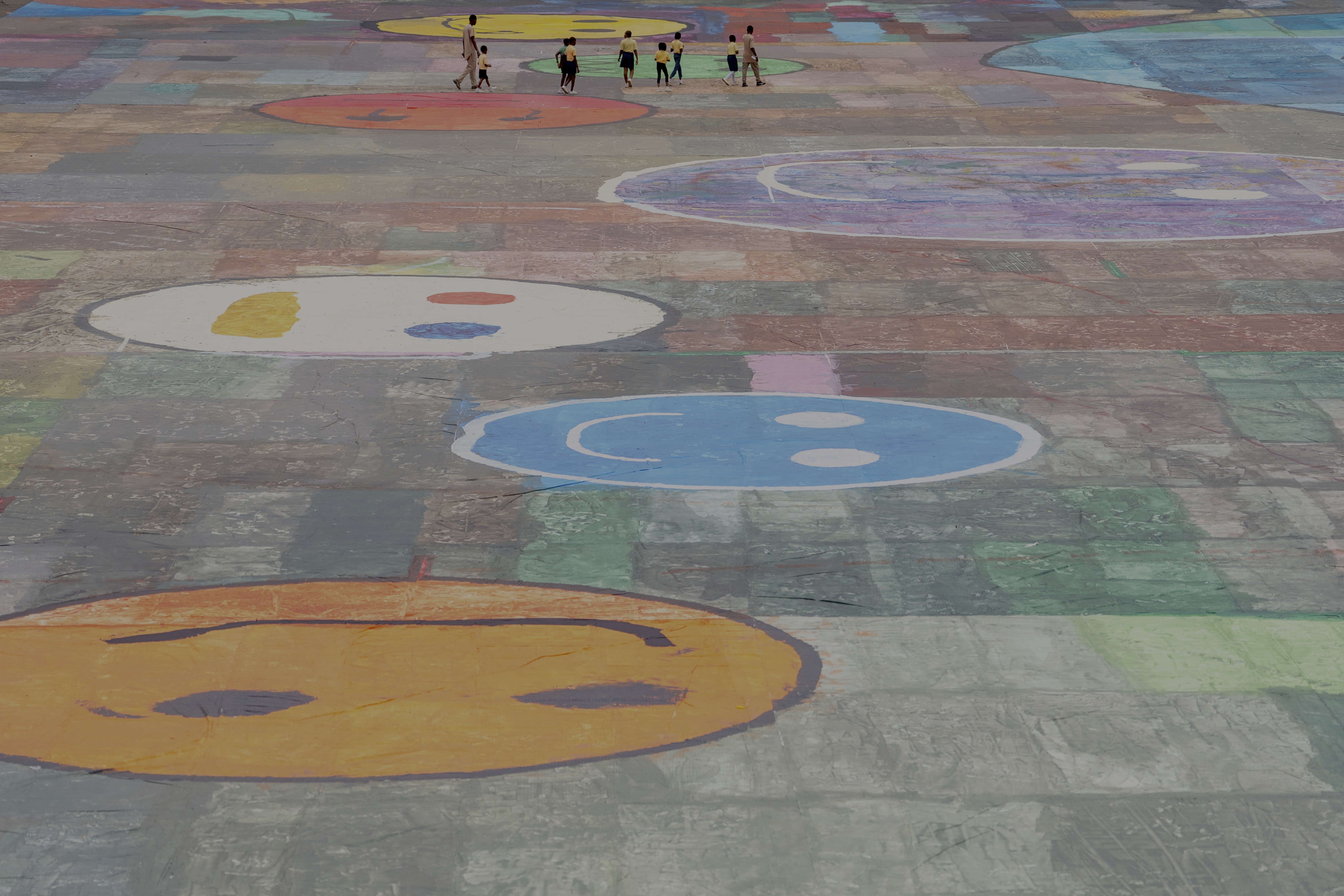 An Ariel view of the canvas painting by Kanyeyachukwu Tagbo-Okeke, a 15-year-old autistic artist who won the Guinness World Record for the largest art canvas, on display at the Eagle Square on World Autism Day in Abuja, Nigeria, Wednesday, April 2, 2025. (AP Photo/David Durowaiye)