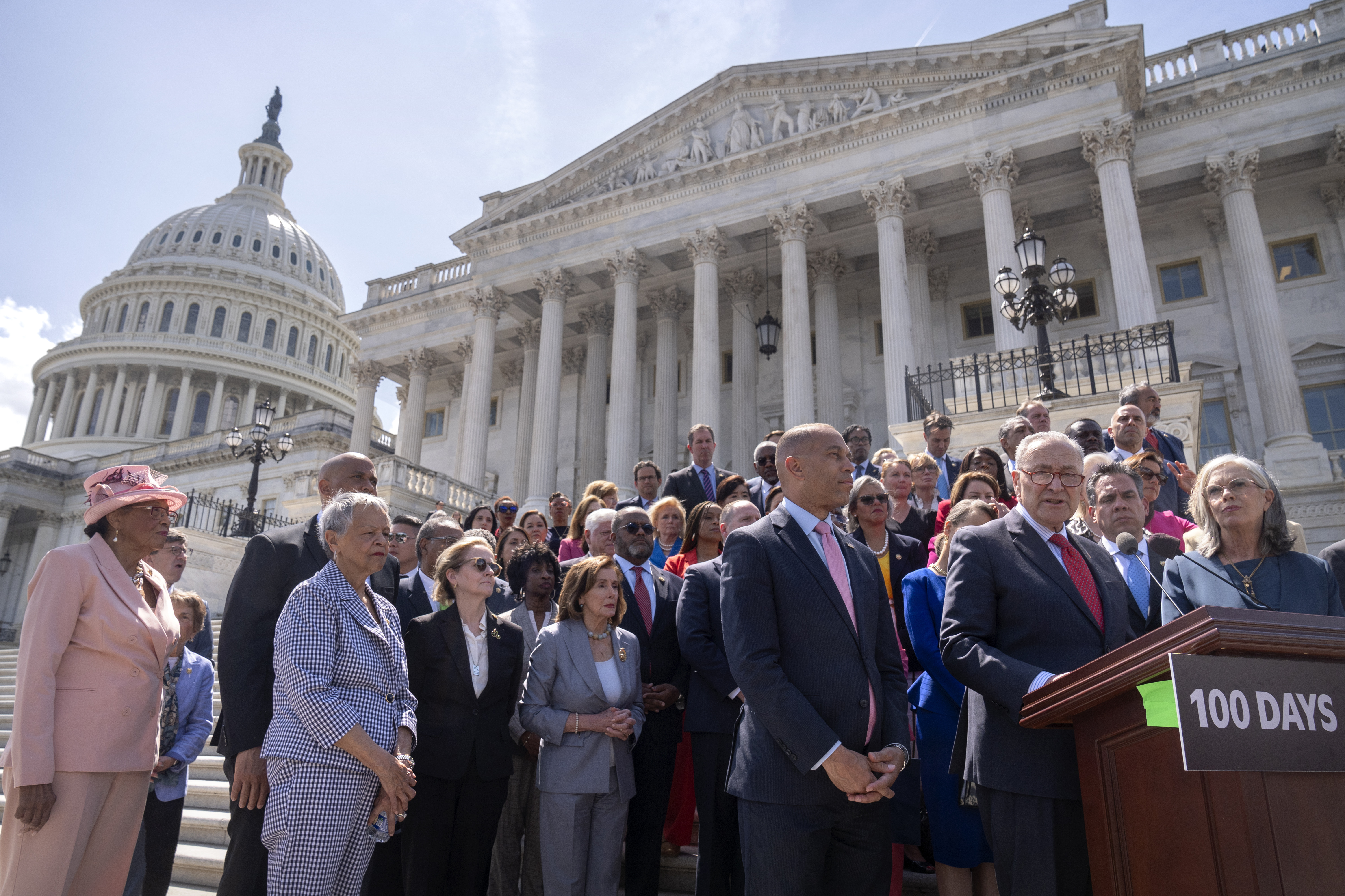 Senate Minority Leader Chuck Schumer, of N.Y., right, is flanked by House Minority Leader Hakeem Jeffries, of N.Y., as he speaks during an event with House and Senate Democrats to mark 100 days of President Donald Trump's term on the steps of the Senate on Capitol Hill, Wednesday, April 30, 2025, in Washington. (AP Photo/Mark Schiefelbein)
