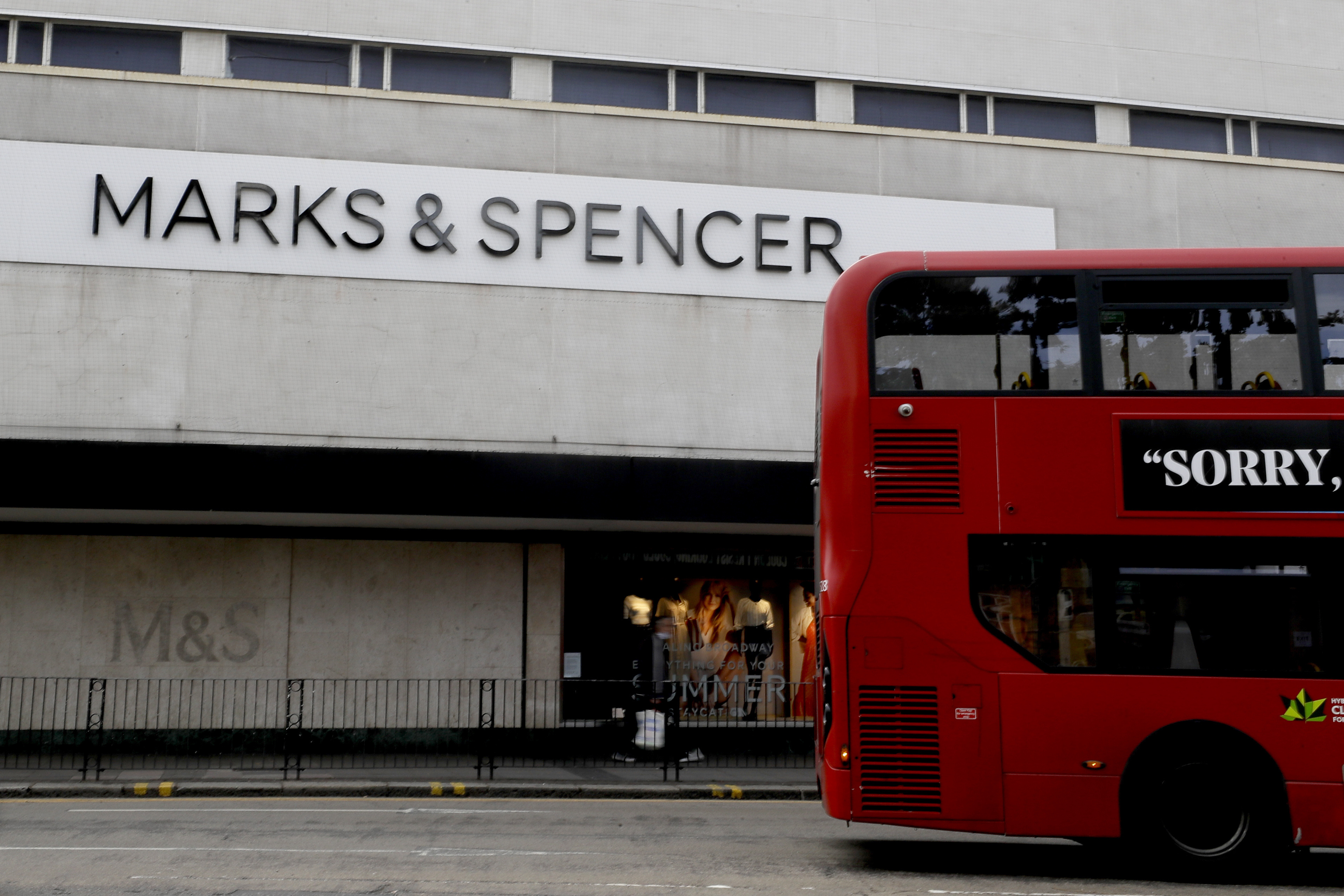 FILE - A bus passes a branch of Marks and Spencer in London, Tuesday, Aug. 18, 2020. (AP Photo/Kirsty Wigglesworth, file)