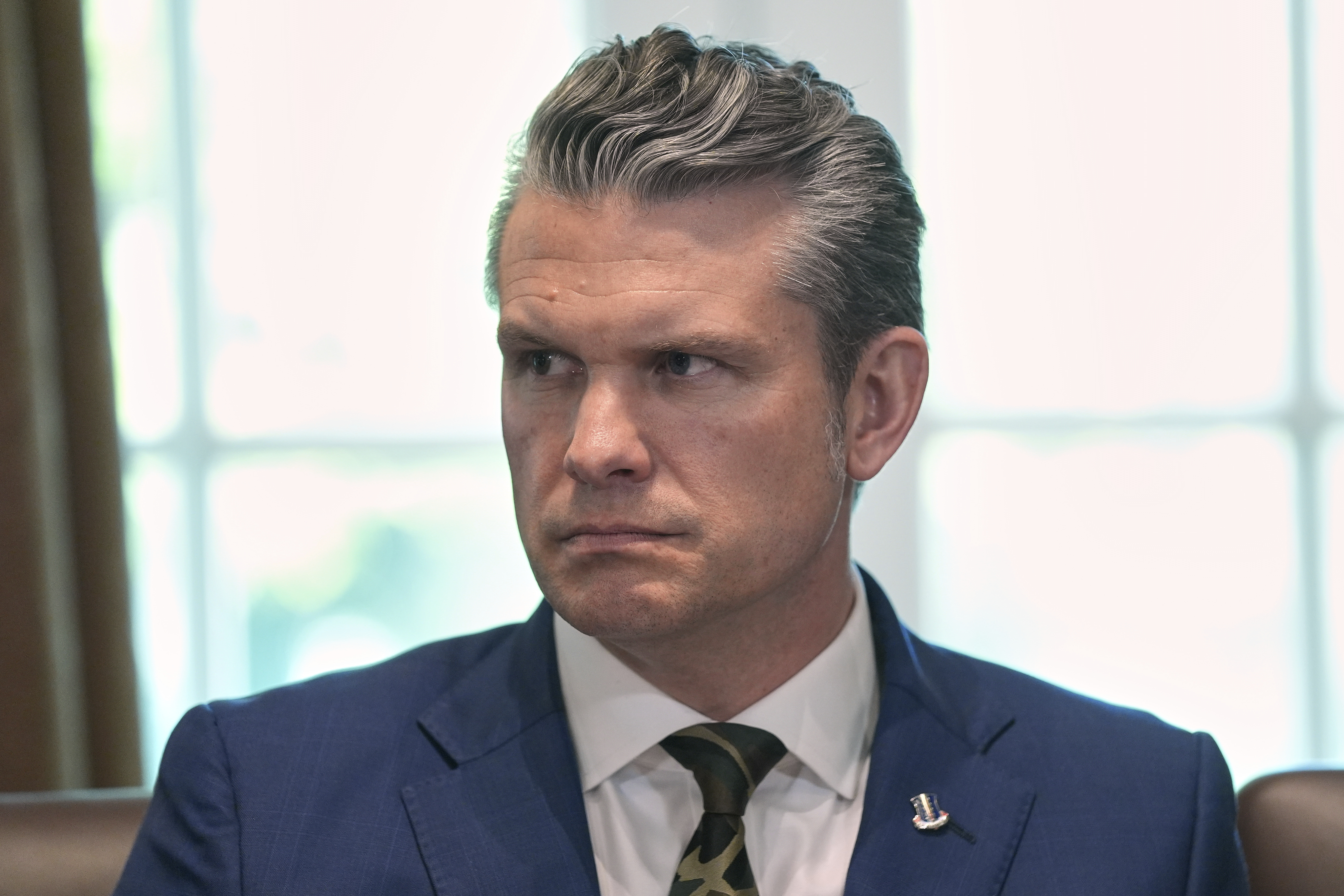 Secretary of Defense Pete Hegseth listens during a cabinet meeting at the White House, Wednesday, April 30, 2025, in Washington. (AP Photo/Evan Vucci)