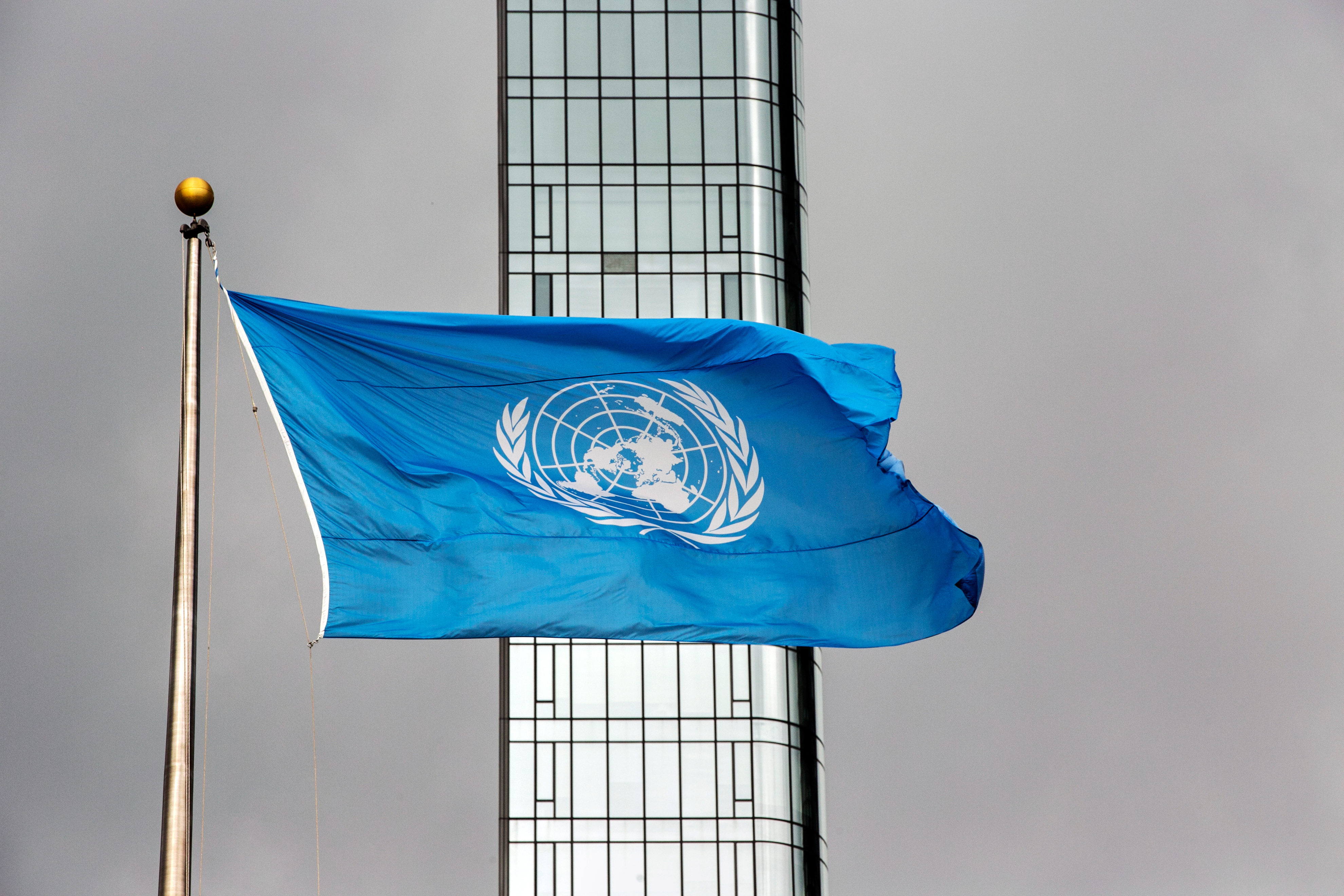 FILE - The United Nations flag flies on a stormy day at the U.N. during the United Nations General Assembly, Sept. 22, 2022. (AP Photo/Ted Shaffrey, File)