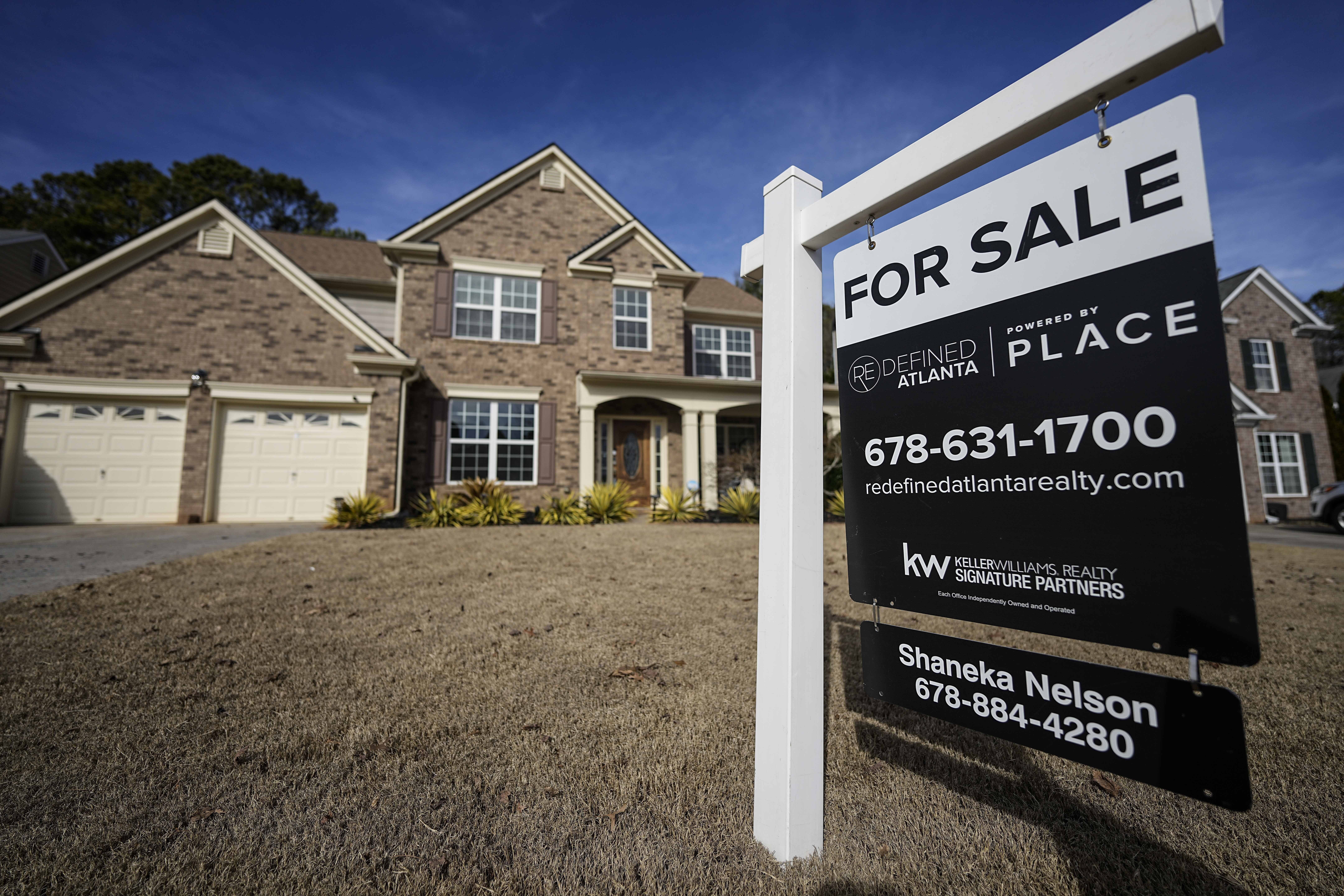 FILE - A sign announcing a home for sale is posted outside a home, Thursday, Feb. 1, 2024, in Aceworth, Ga., near Atlanta. (AP Photo/Mike Stewart, File)